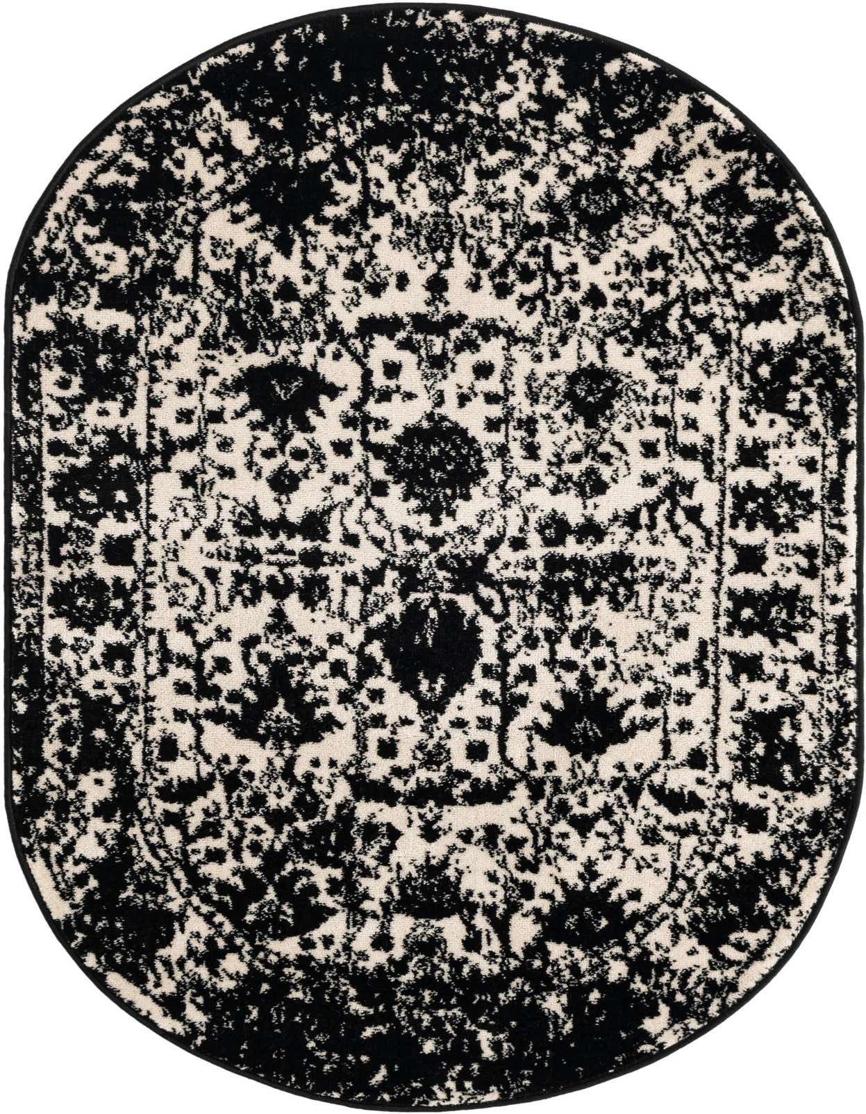An oval 3' 0 x 5' 3 black and ivory shabby-chic rug with a distressed floral and traditional pattern.