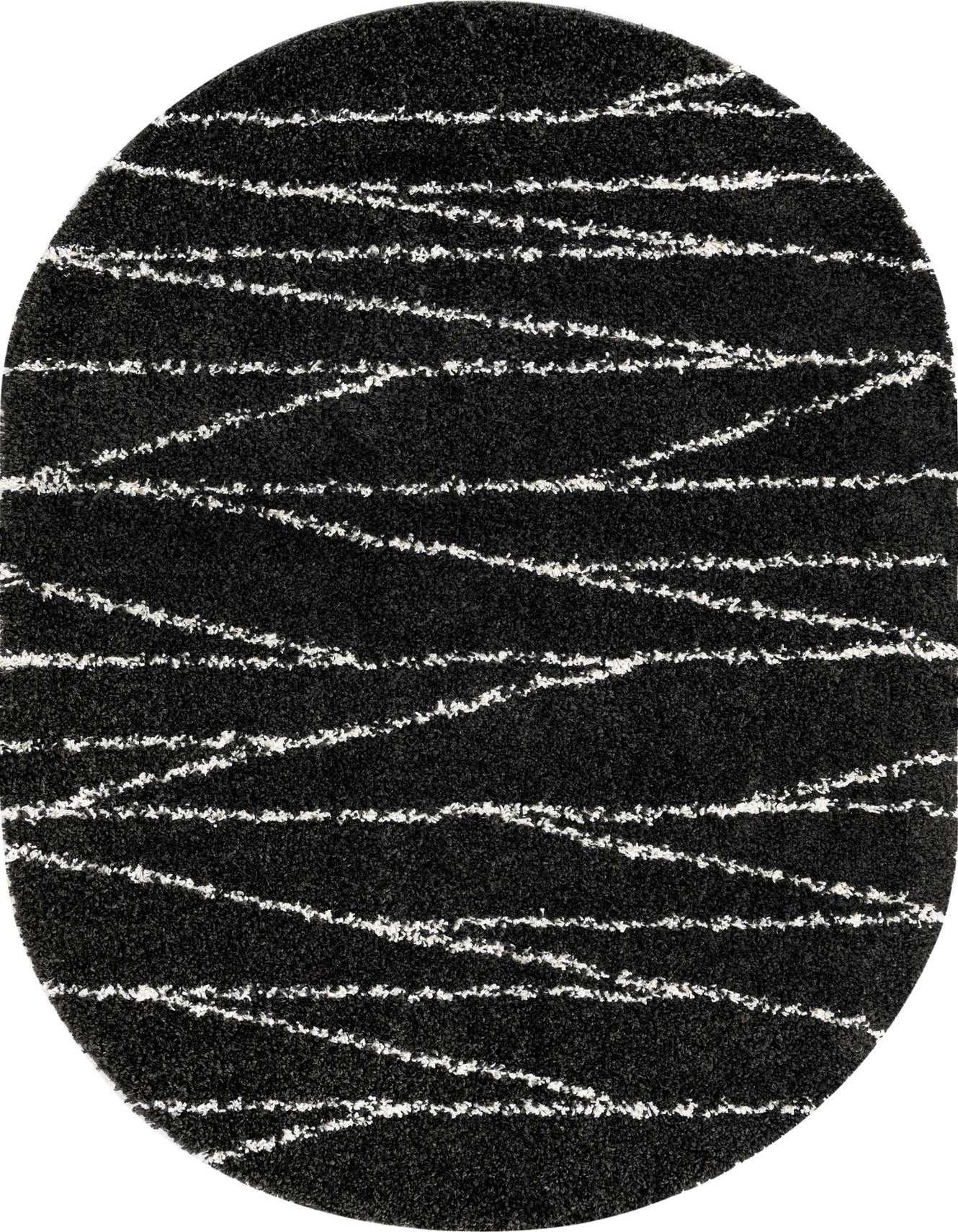 An oval black shag rug with textured white horizontal and diagonal stripes, suitable for a modern living room.