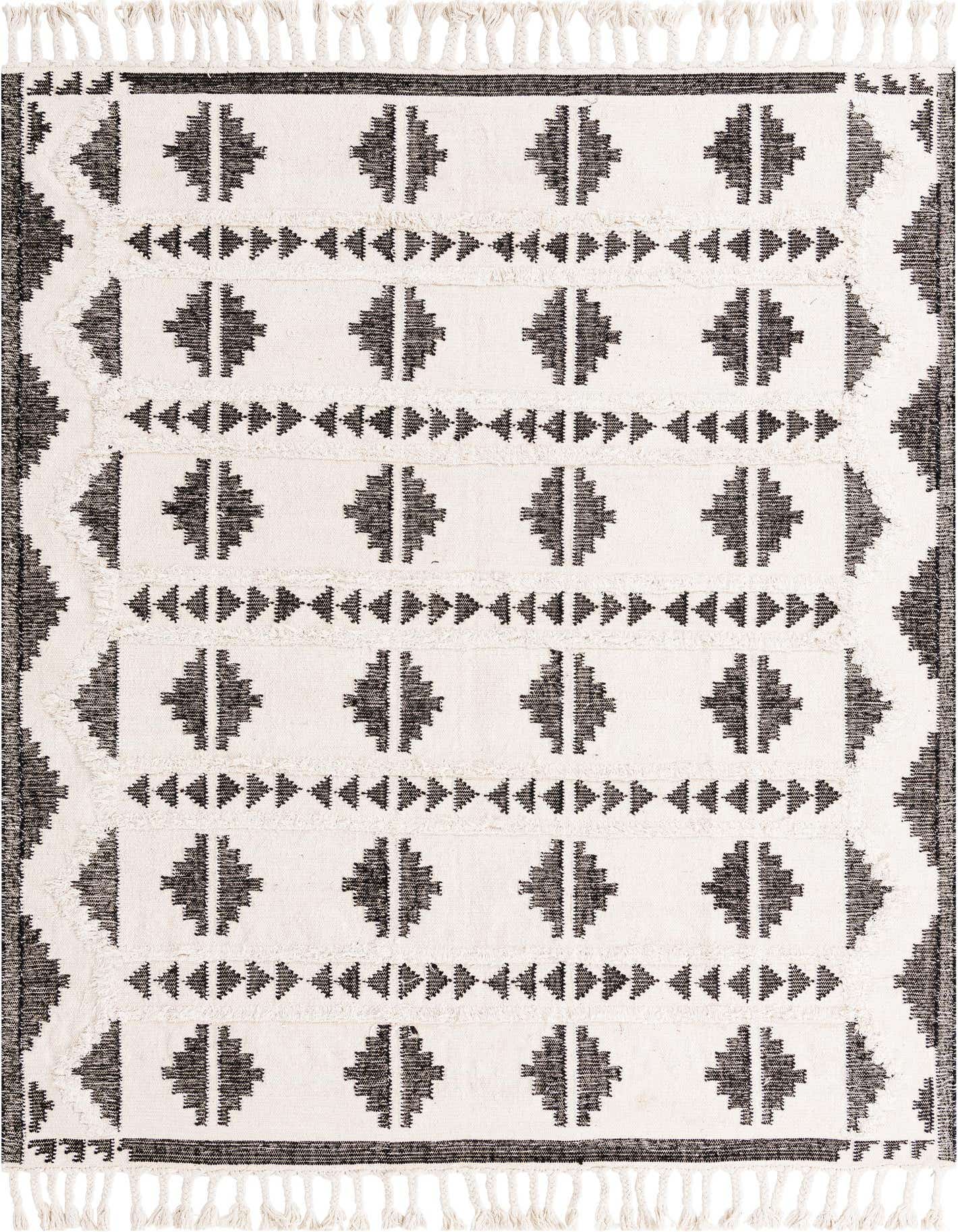 An 8x10 rectangular Arizona Collection rug featuring a black and white tribal pattern with fringe.
