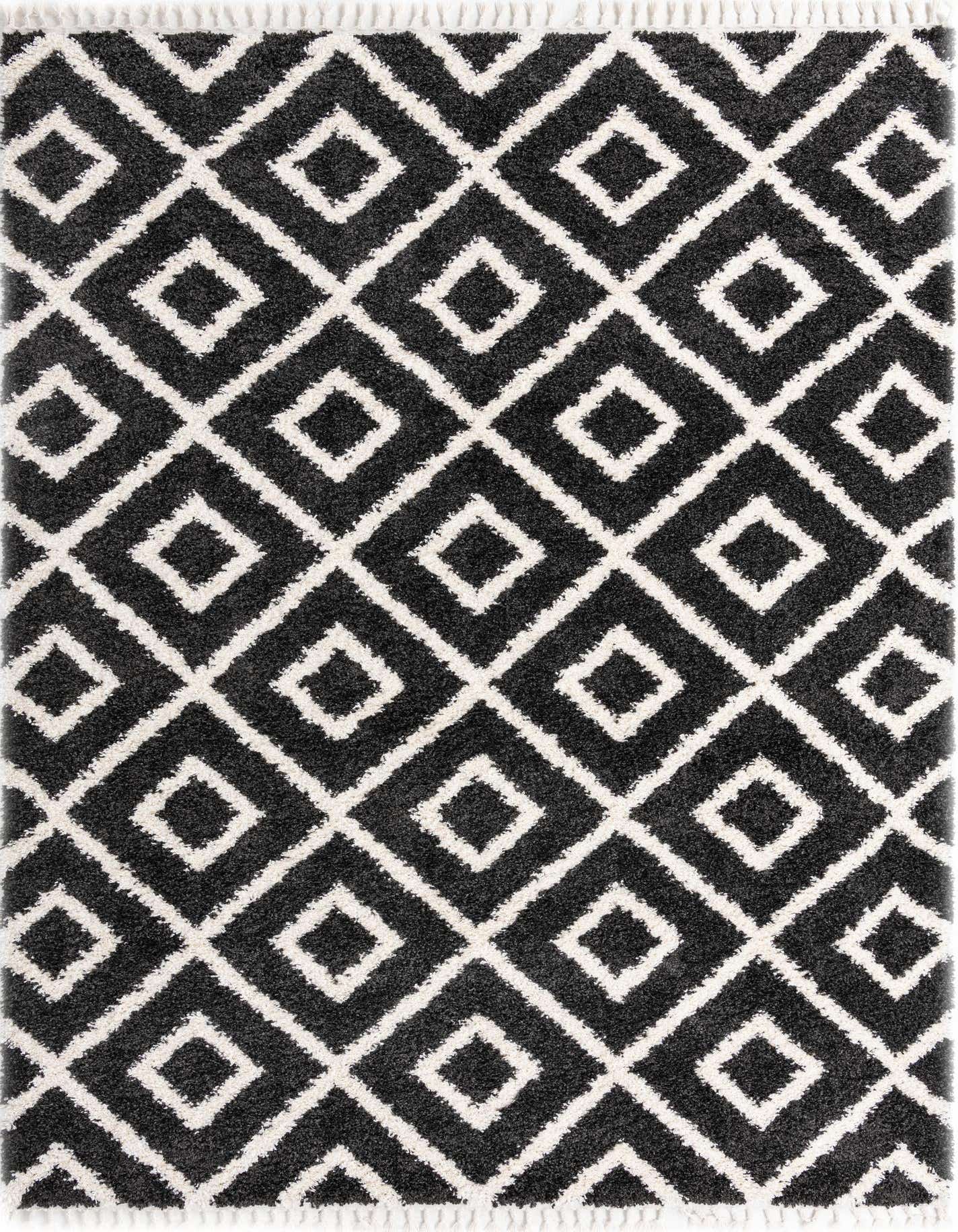 A 9x12 rectangular black and white shag rug with a modern geometric diamond pattern, suitable for a living room.