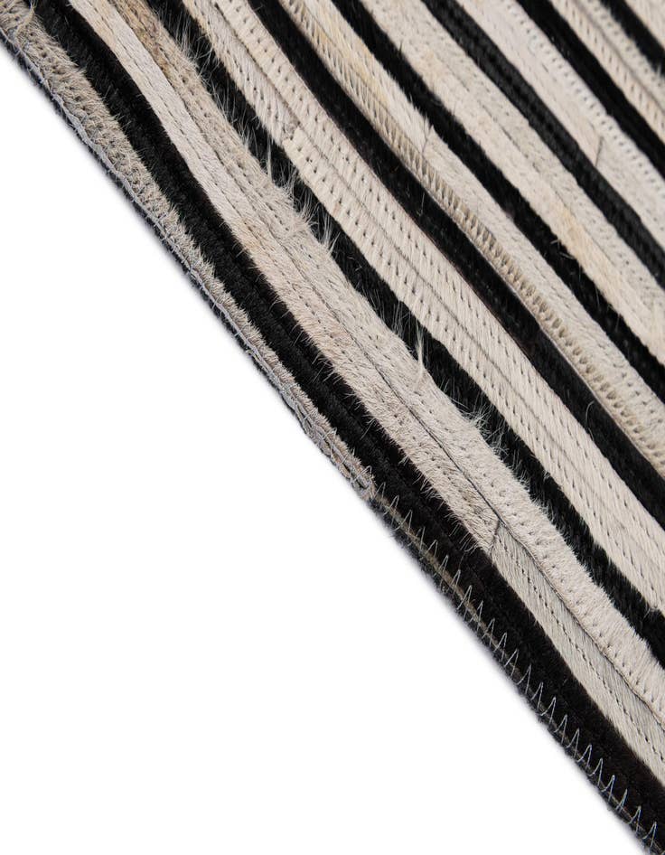 Detail image of  5' 2 x 8' Cowhide - Patchwork Rug