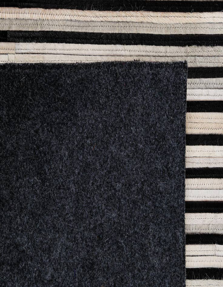 Detail image of  5' 2 x 8' Cowhide - Patchwork Rug