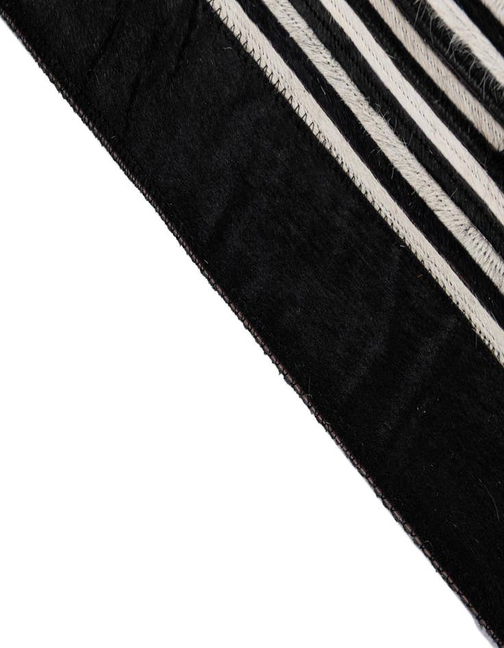 Detail image of  5' 1 x 7' 11 Cowhide - Patchwork Rug