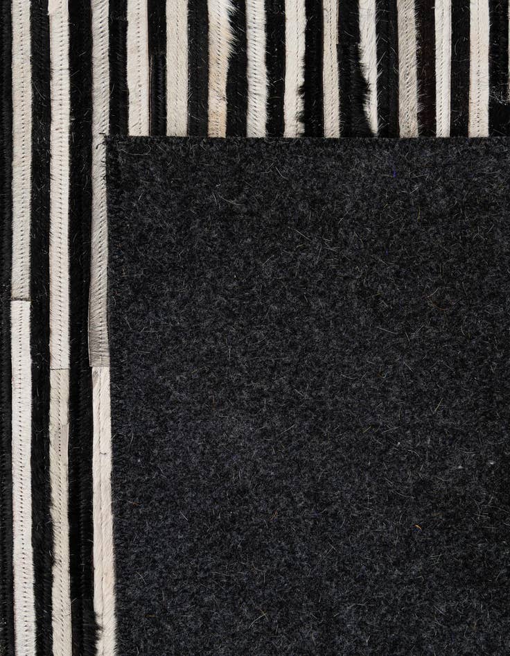 Detail image of  5' 1 x 7' 11 Cowhide - Patchwork Rug