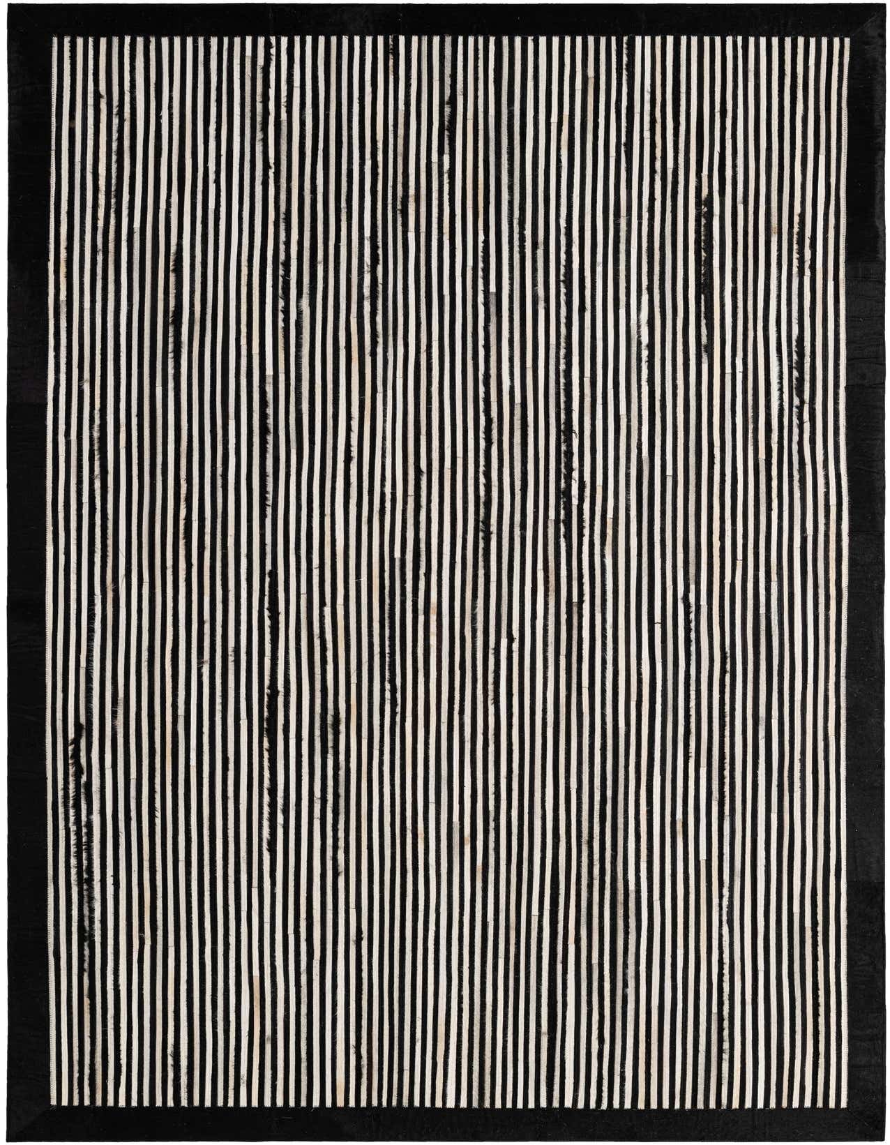 A 5x8 rectangular black and white striped cowhide rug with a modern design, suitable for a living room.