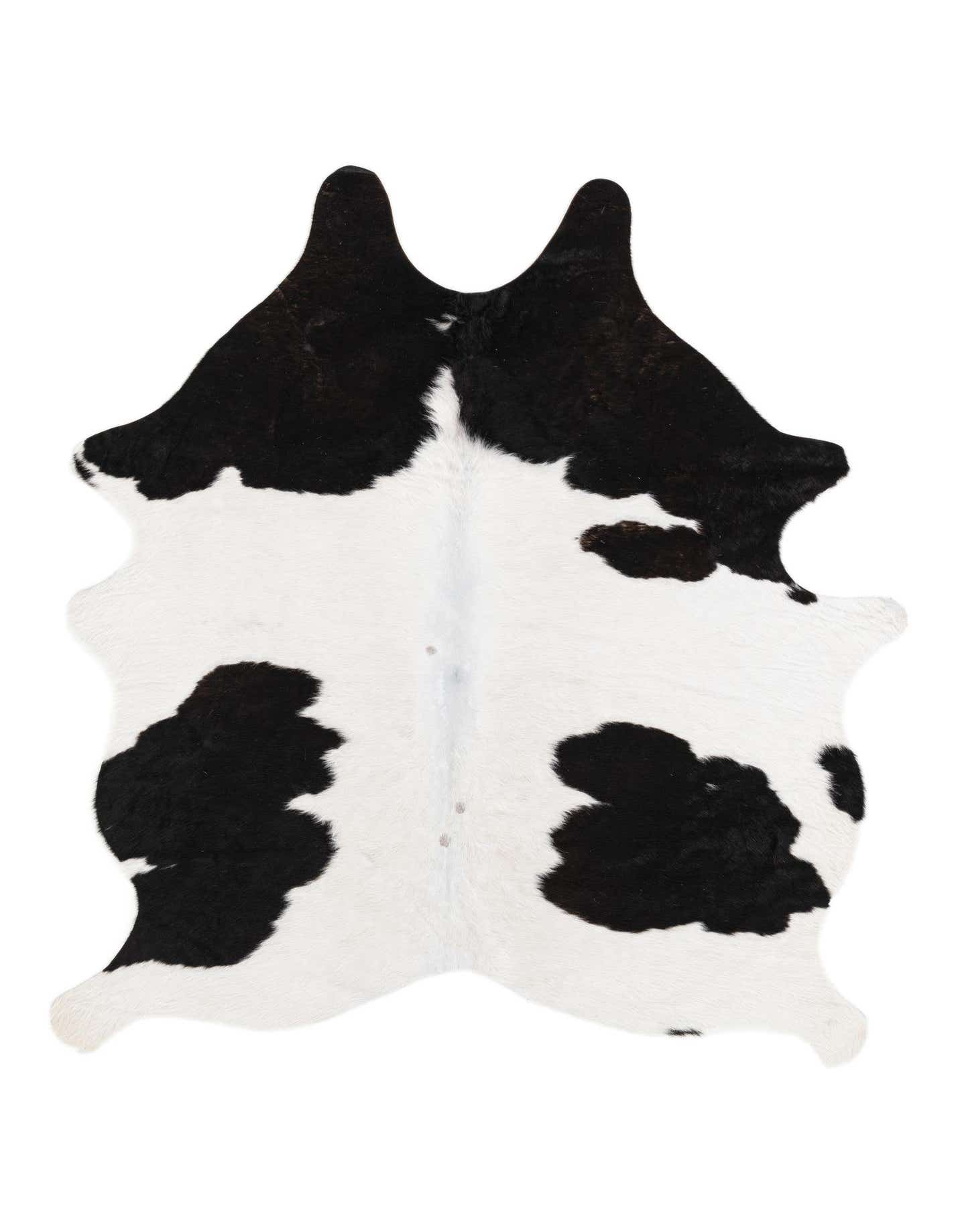 A 4x6 black and white cowhide rug with an irregular, natural shape and modern spots.