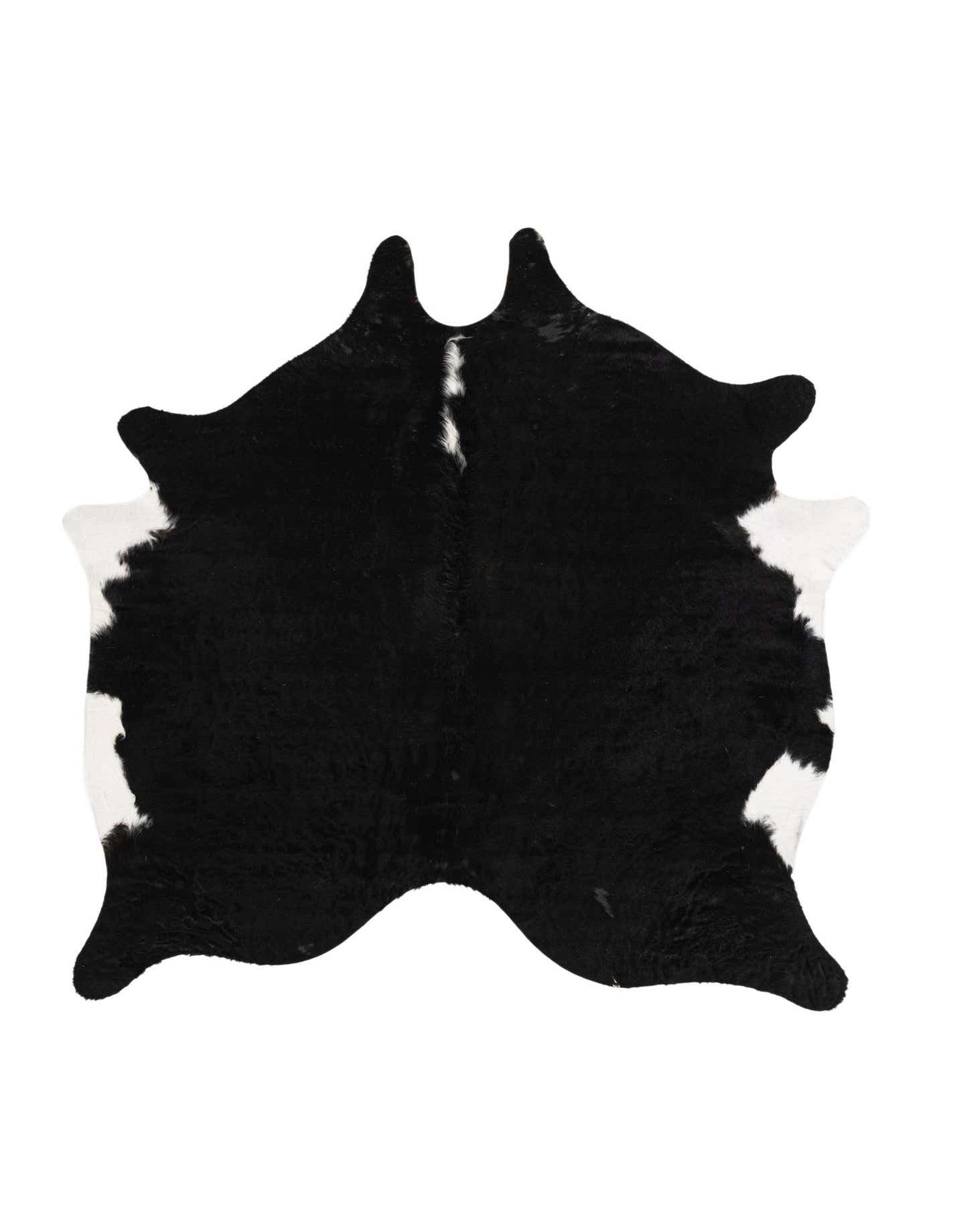 A 5x8 rectangular black and white cowhide rug with natural, irregular edges, featuring a prominent black center with white patches along the sides.