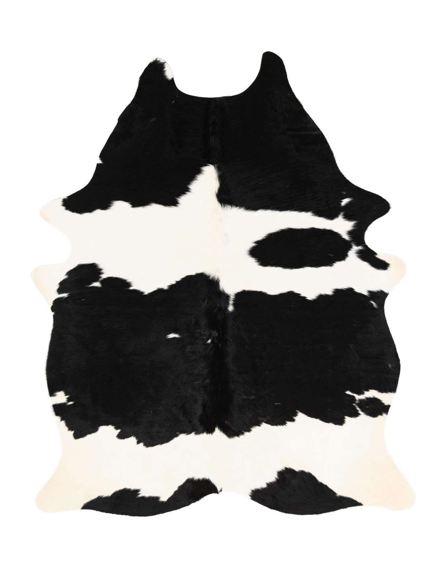 A 4x6 black and white cowhide rug with an irregular, natural shape, showcasing its modern, textured flat pile.