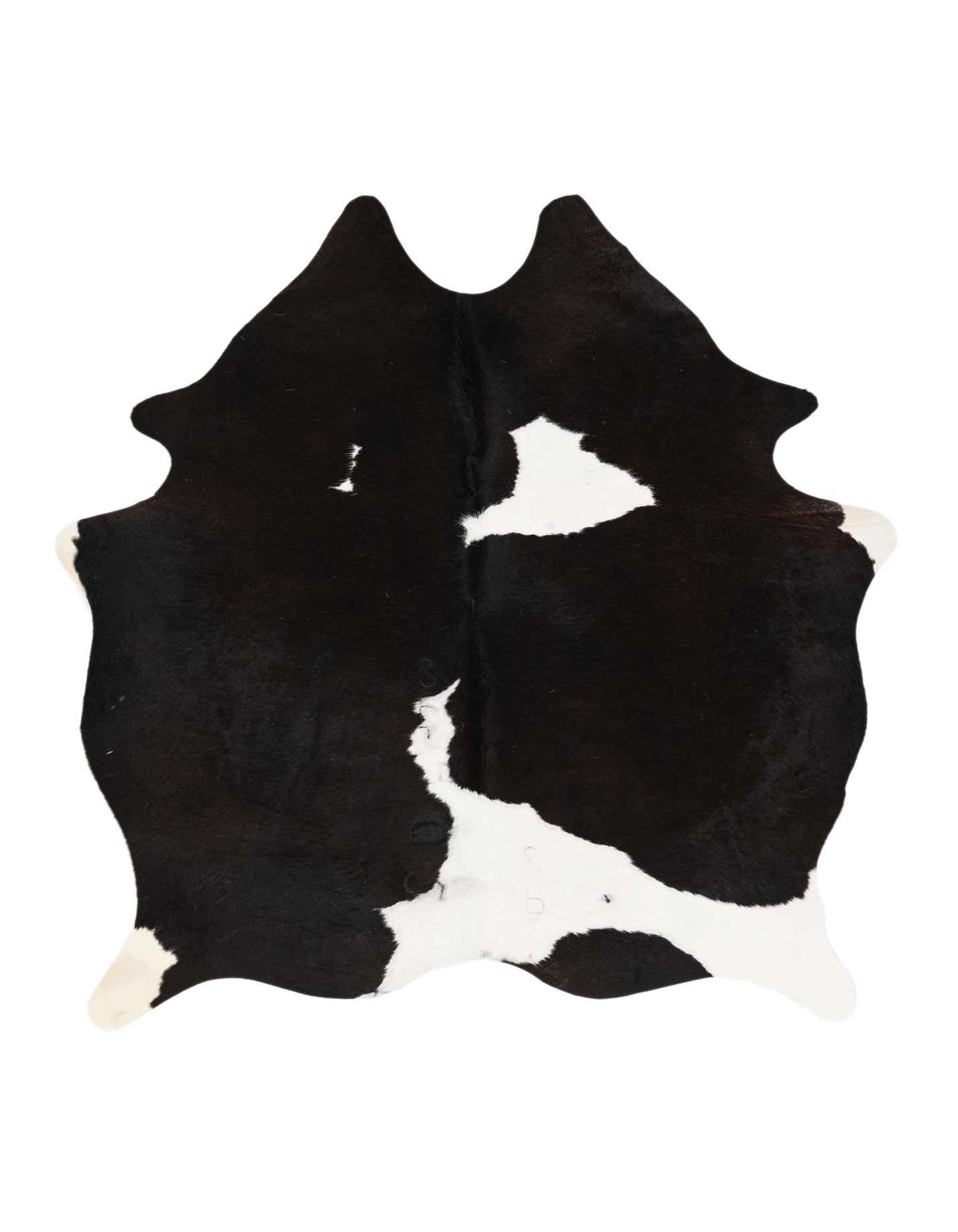 A 5x7 rectangular black and white cowhide rug with an organic, irregular shape and natural markings.