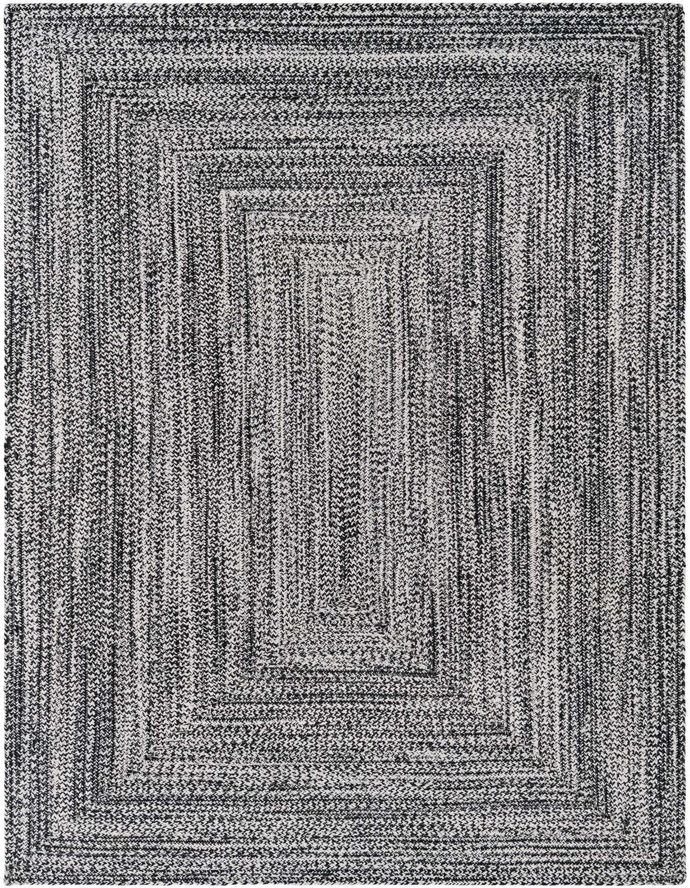 A 5x8 rectangular black and white braided rug with a textured, striped modern pattern, suitable for indoor or outdoor use.