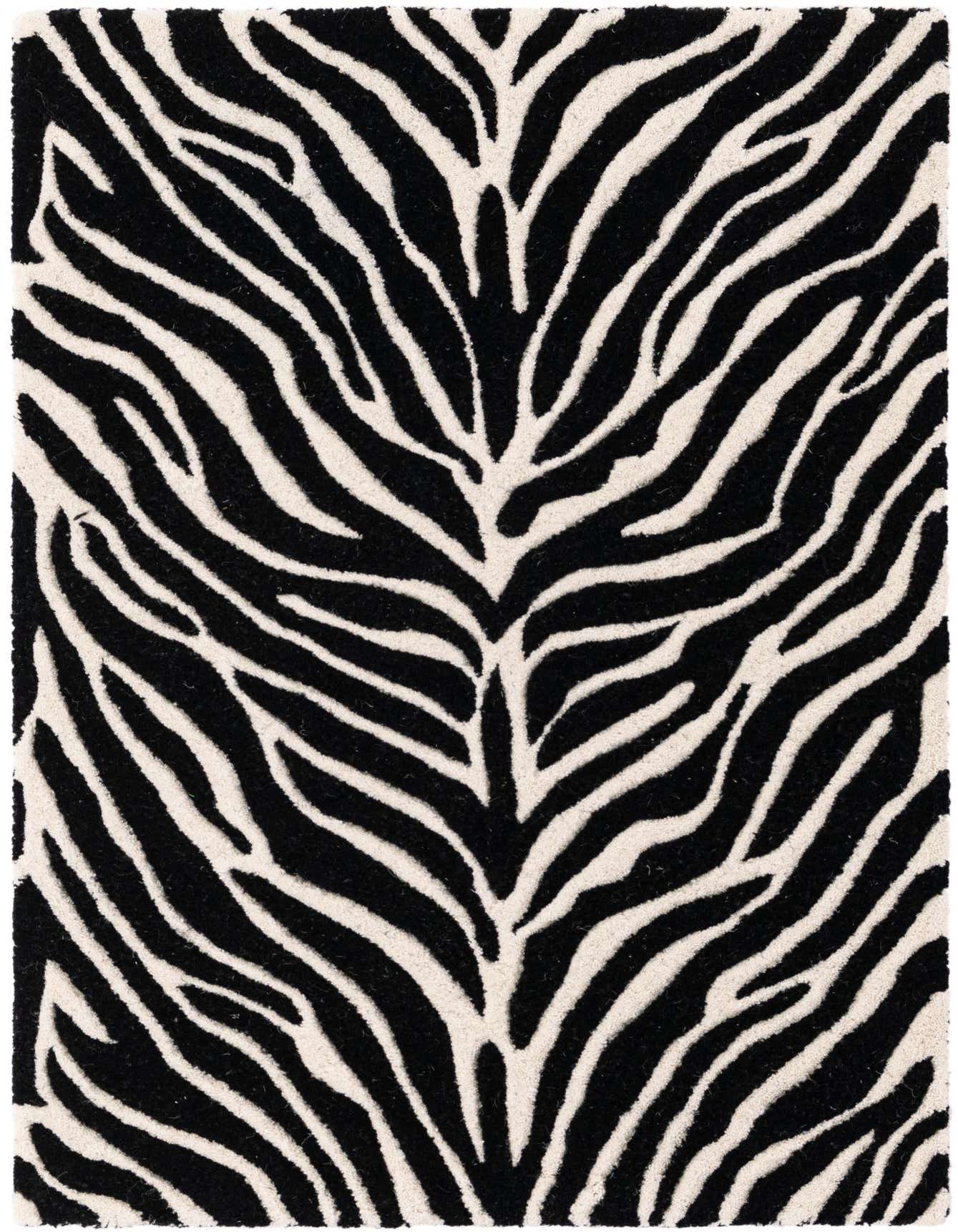 A 2x3 rectangular black and white zebra print rug with a high, textured pile, perfect for an indoor space.