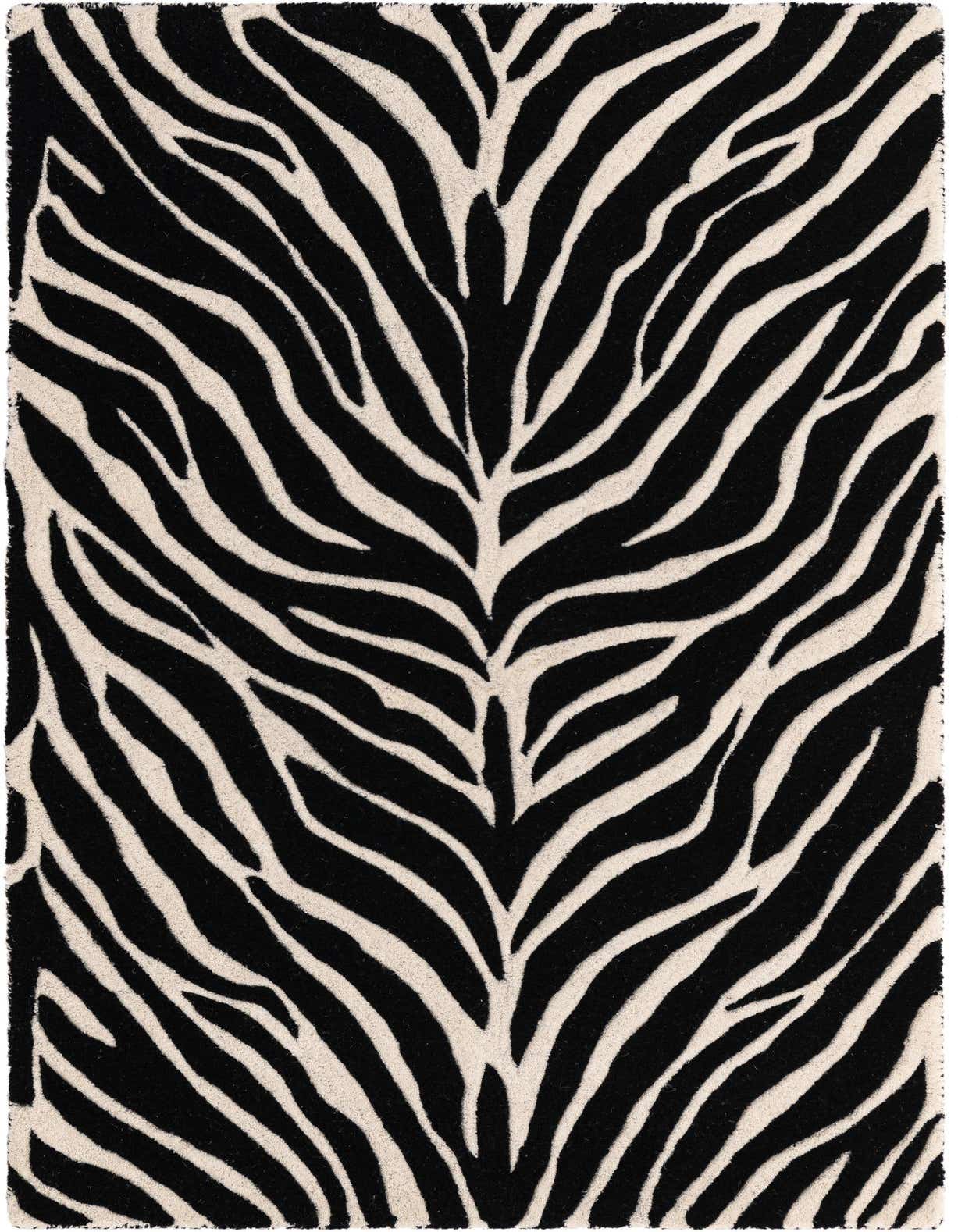 A 3x5 rectangular black and white zebra print wool rug with a high pile, perfect for a modern living room.