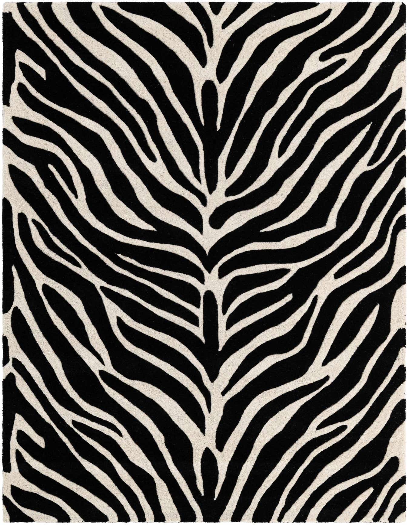 A 4x6 rectangular black and white zebra print rug with a high, textured pile, perfect for a modern living room.