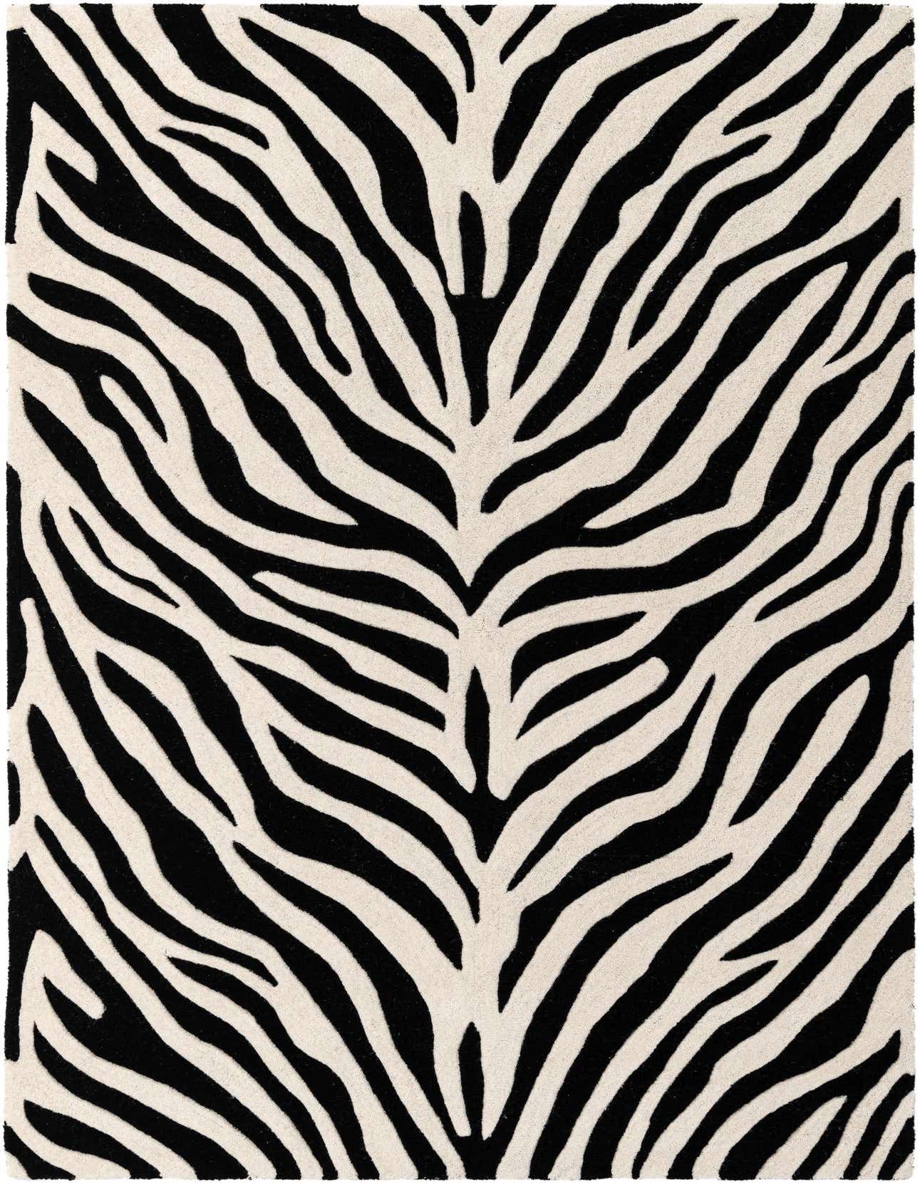 A 5x8 rectangular black and white zebra print rug with a high, textured pile, perfect for a modern living room.