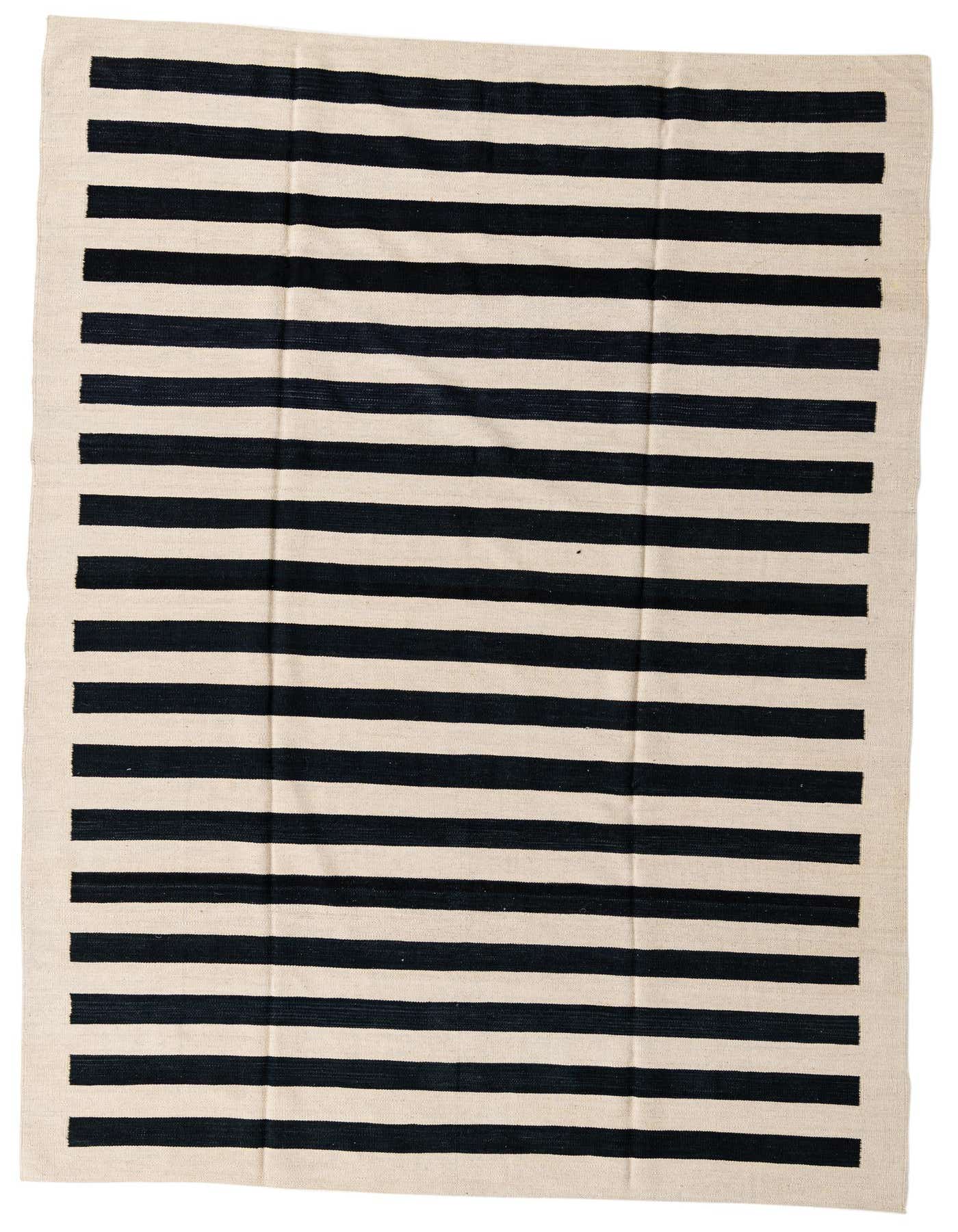 A 7x10 rectangular flatweave rug with bold black and cream horizontal stripes, suitable for a modern living room.
