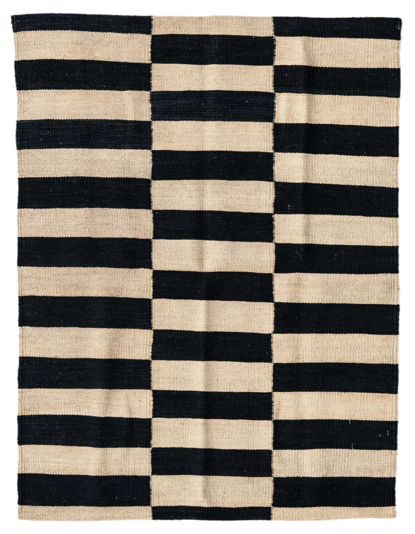 A 3x4 rectangular flatweave rug with a bold black and cream striped tribal pattern, suitable for various indoor spaces.
