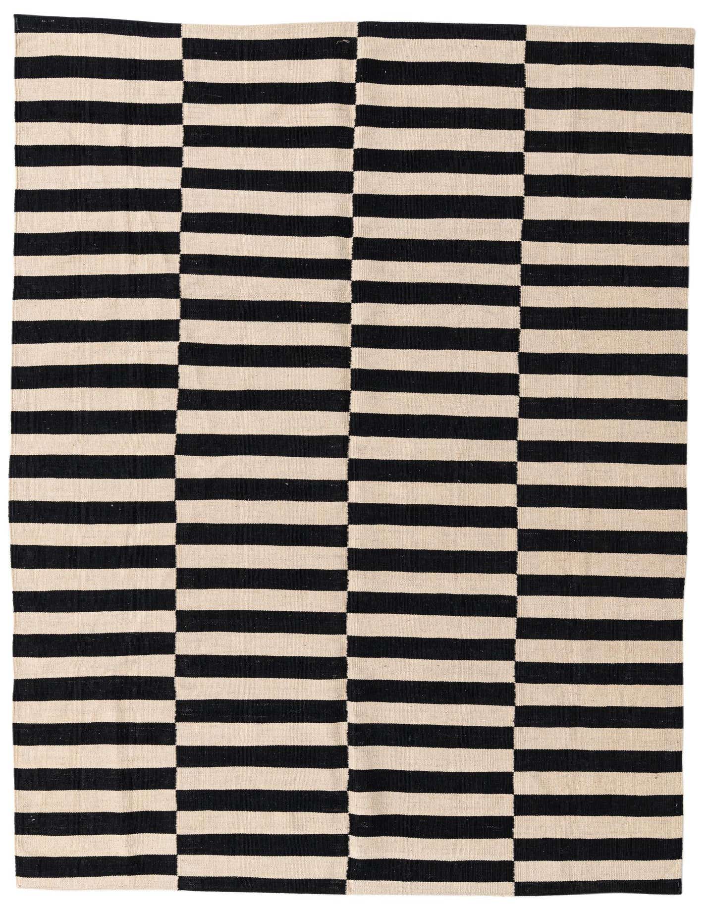 A 5x8 rectangular black and cream flatweave wool rug with a modern tribal stripe pattern.