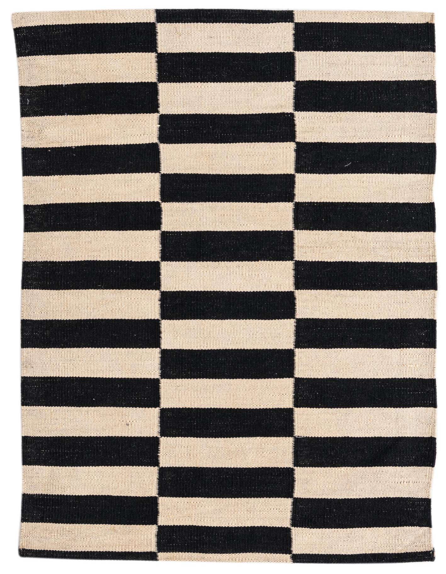 A 3x4 rectangular flatweave rug featuring a bold black and ivory striped pattern, perfect for a modern or tribal decor.