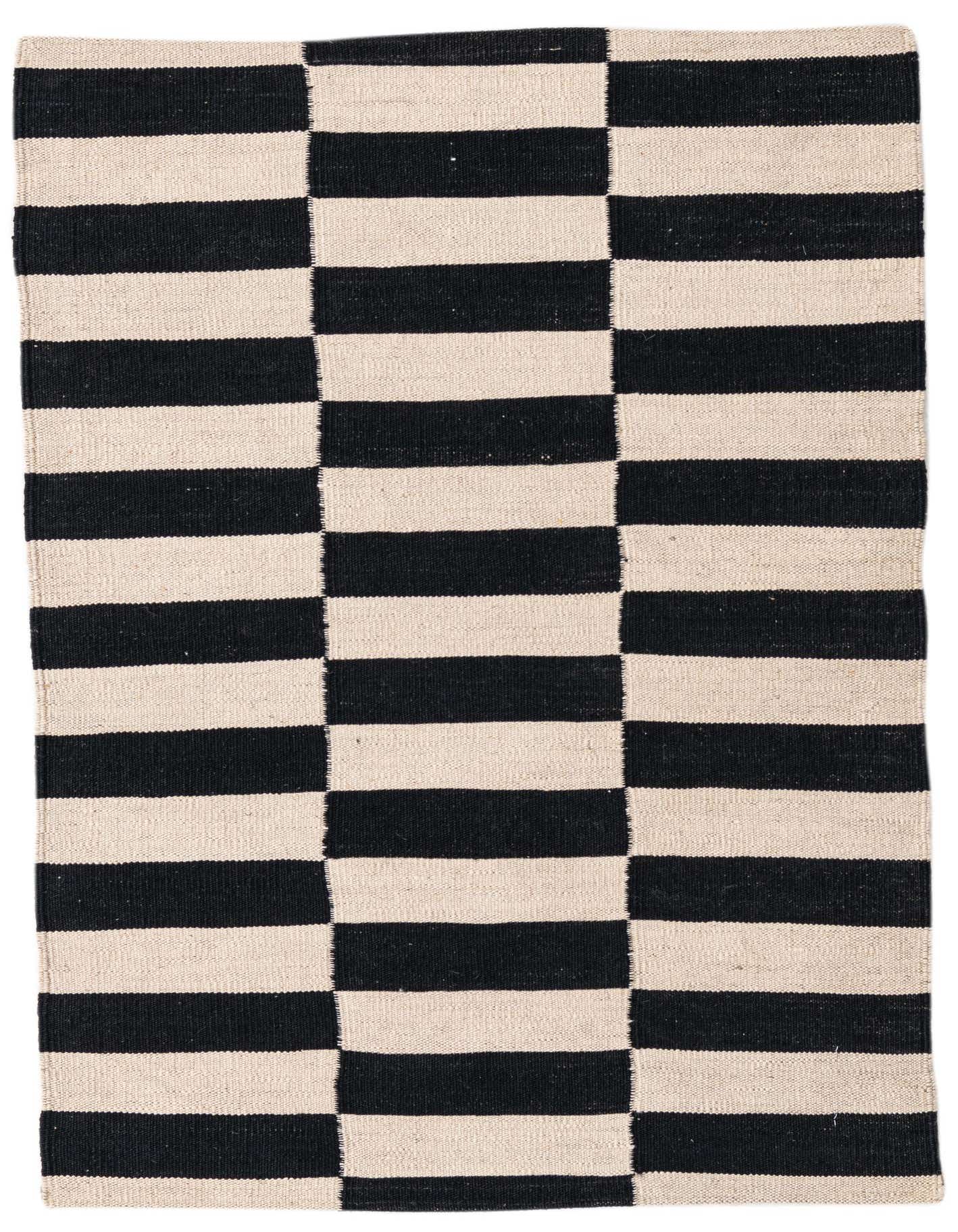 A 3x4 rectangular flatweave rug featuring a bold black and cream striped pattern, perfect for modern and tribal decor.