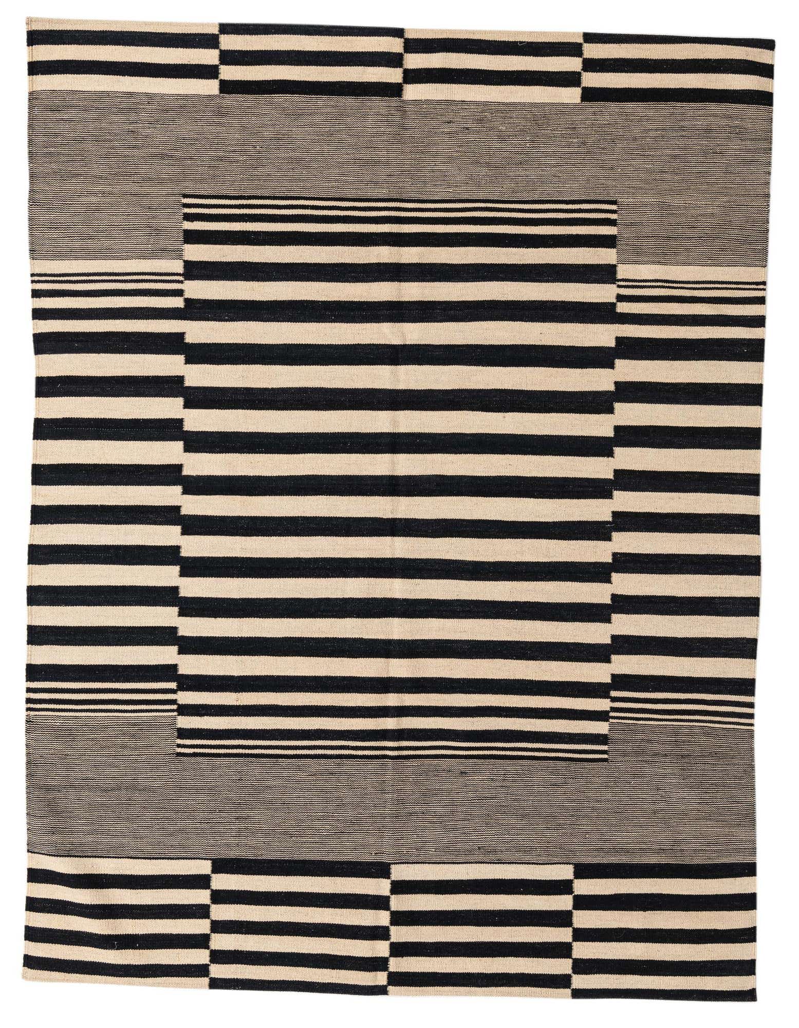 A 6x9 rectangular Kilim Modern rug with a bold black and ivory striped tribal pattern, featuring a central striped rectangle and a contrasting border.