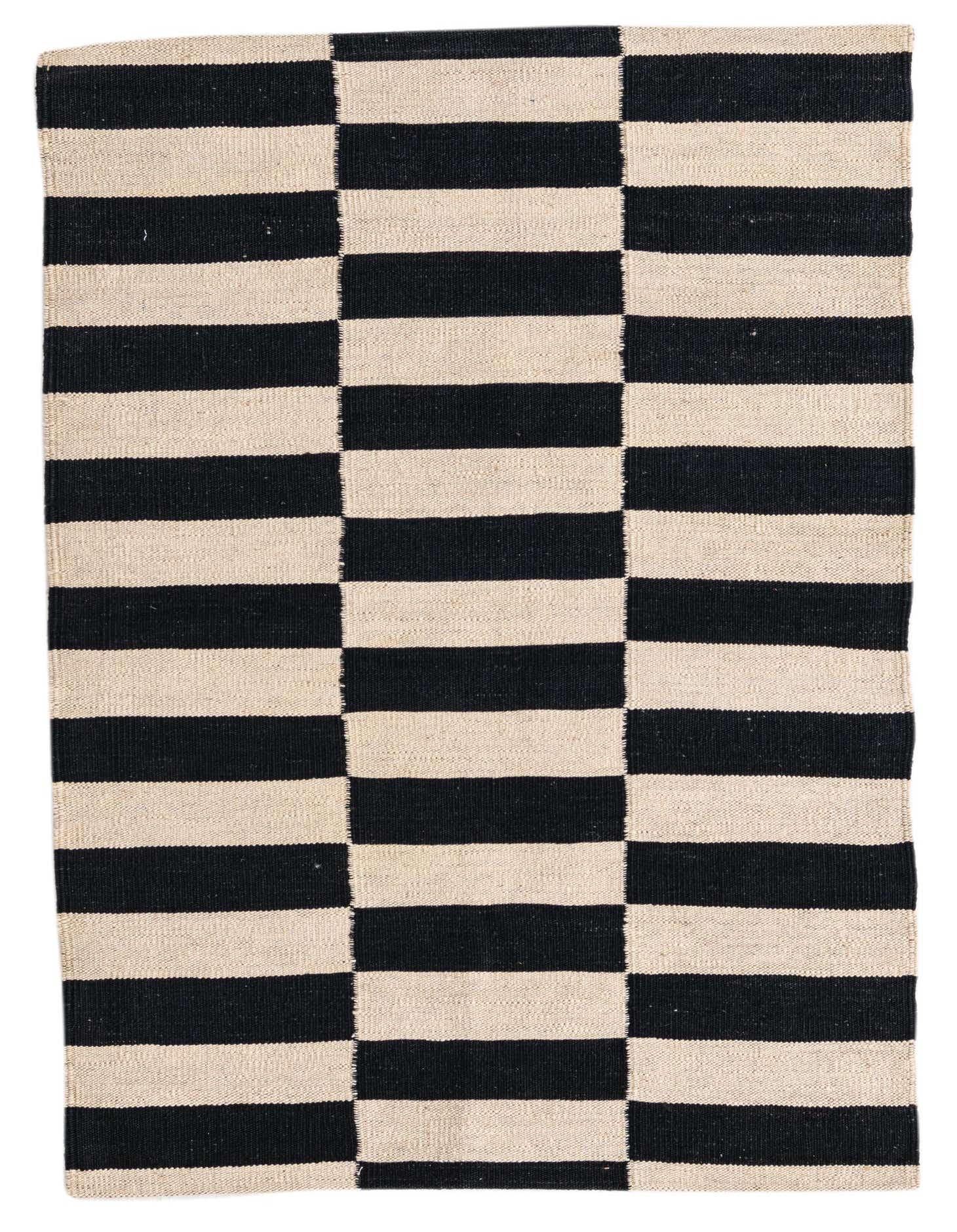 A 3x4 rectangular black and ivory flatweave rug with a bold, modern striped tribal pattern.