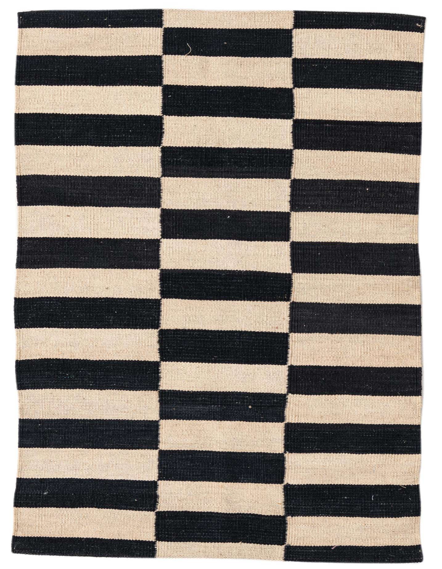 A 3x4 rectangular flatweave rug with a bold black and ivory striped pattern, perfect for a modern or tribal aesthetic.