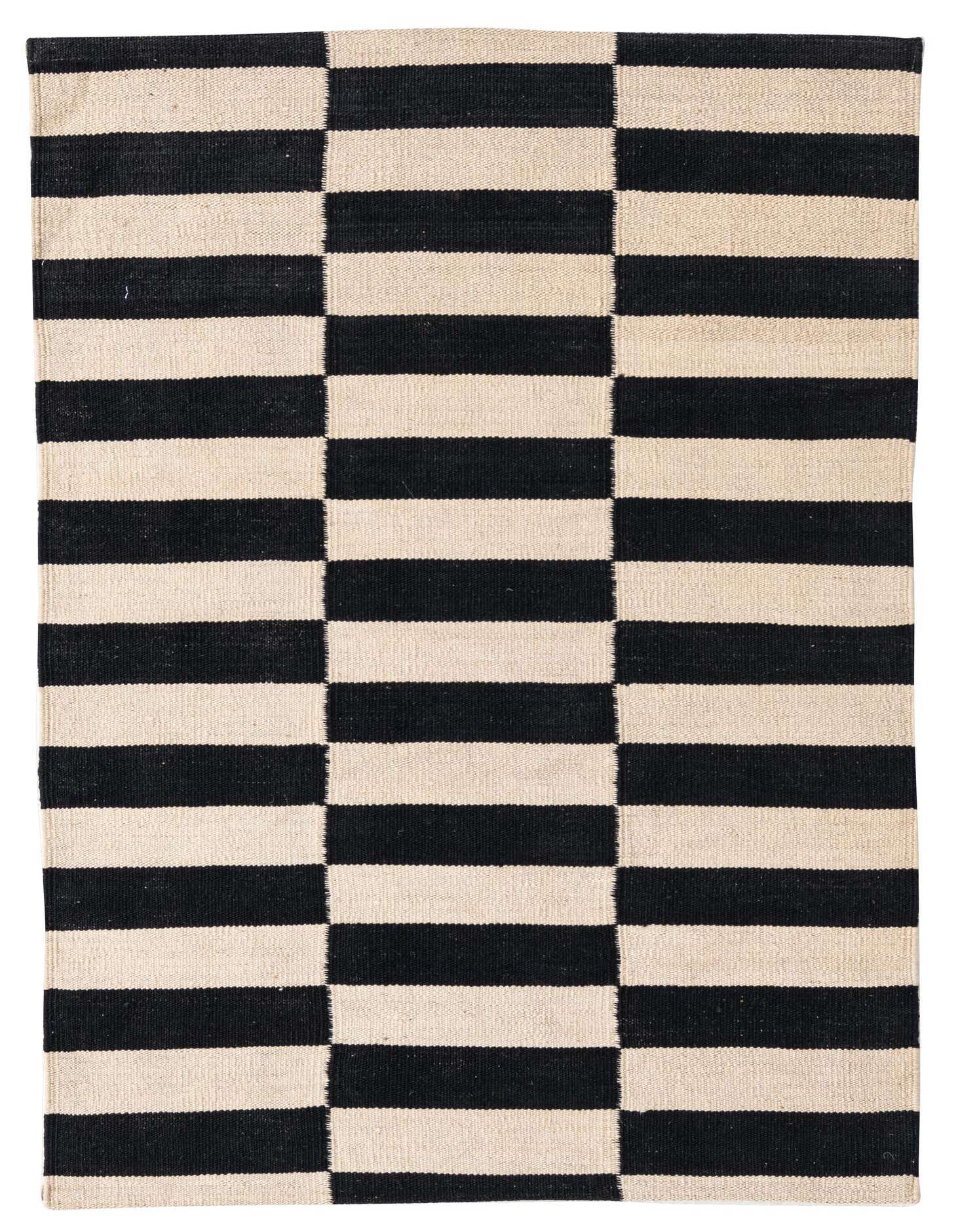 A 3x4 rectangular flatweave rug featuring a bold black and ivory striped pattern, perfect for a modern or tribal decor.