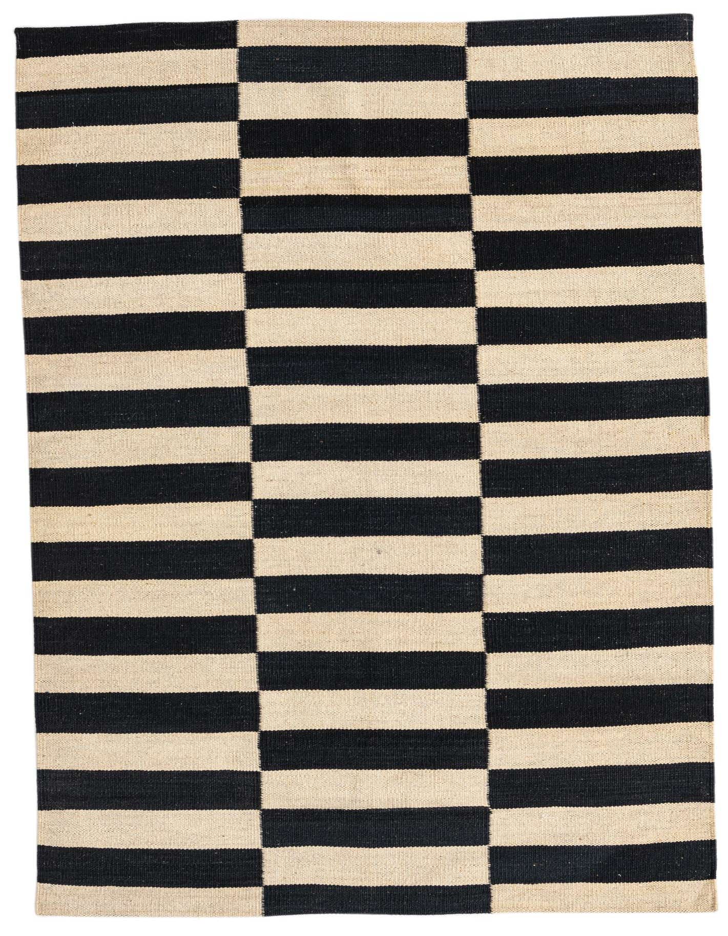 A 3x5 rectangular Kilim Modern rug with a bold black and cream striped tribal pattern, ideal for an entryway or kitchen.