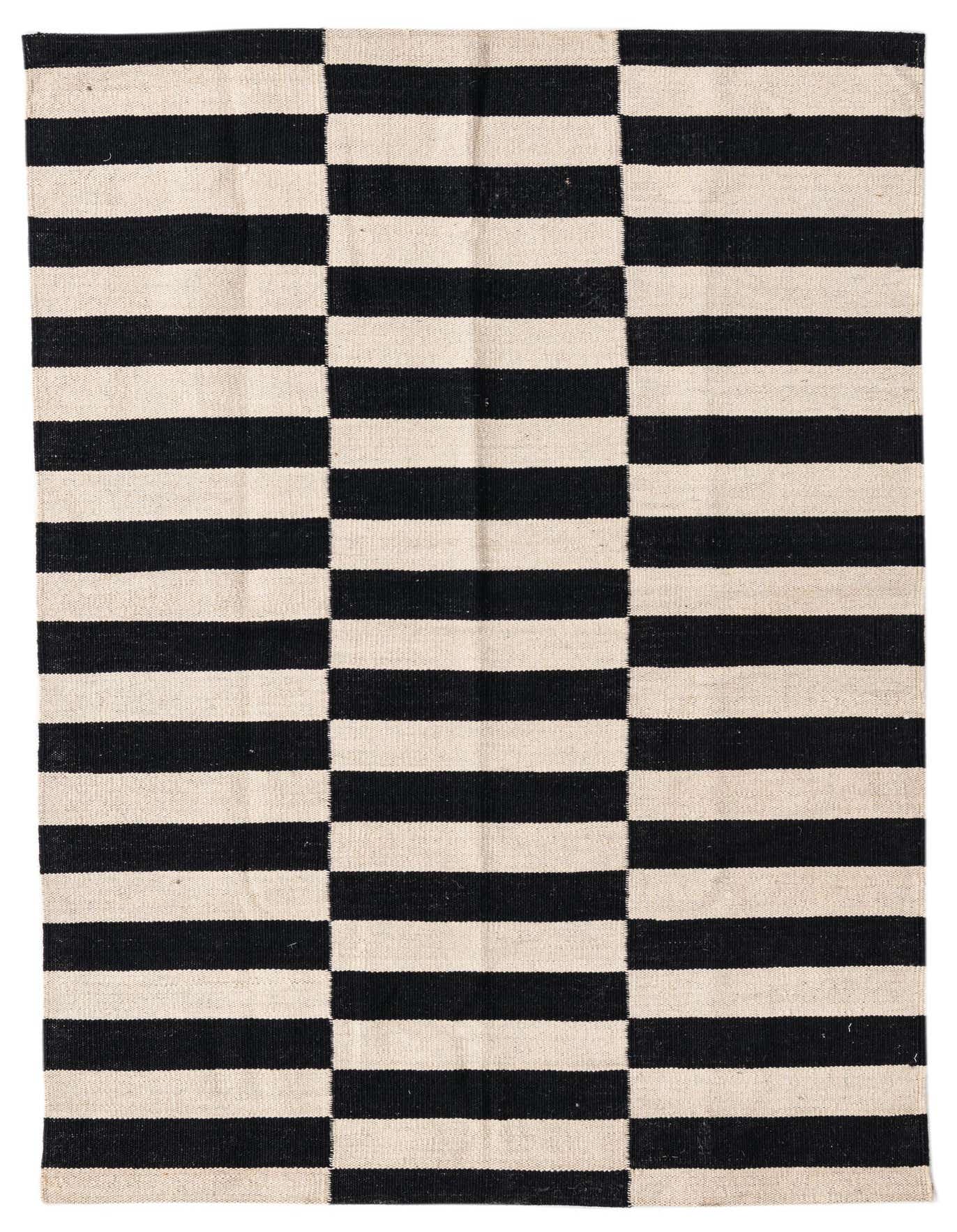 A 3x5 rectangular black and white flatweave wool rug with a bold, modern striped pattern.