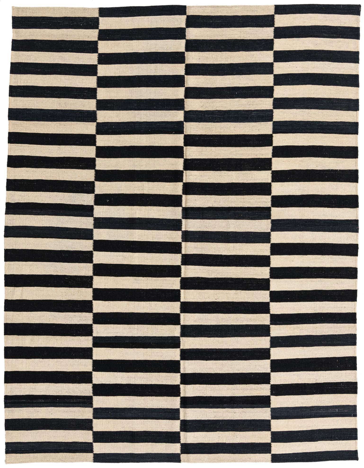 A 6x9 rectangular flatweave rug featuring a bold black and ivory striped tribal pattern, suitable for a modern living room.