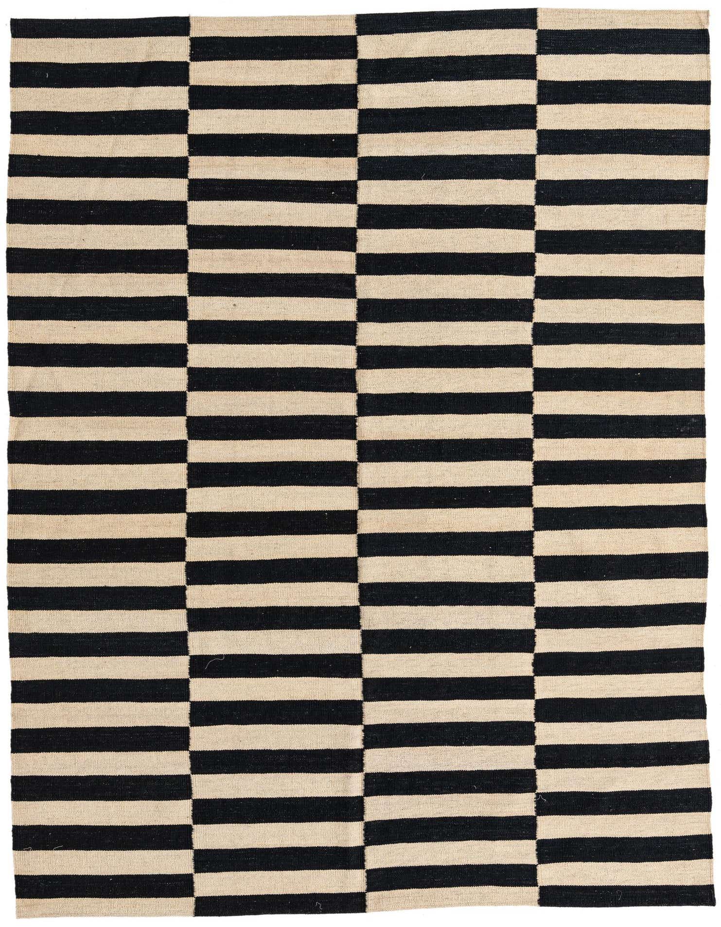 A 6x9 rectangular Kilim Modern rug with a bold black and ivory striped pattern, suitable for a living room.
