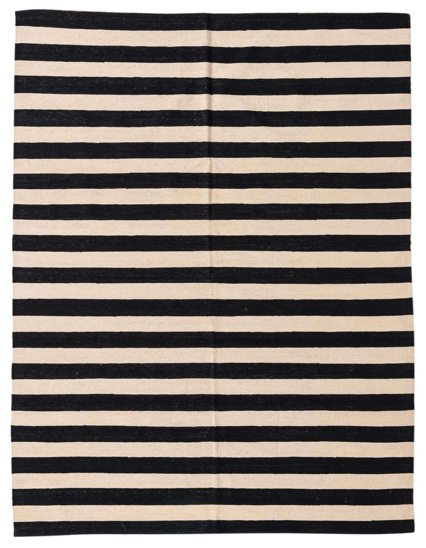A 5x8 rectangular black and cream striped flatweave rug, handmade from wool, suitable for a modern living room.