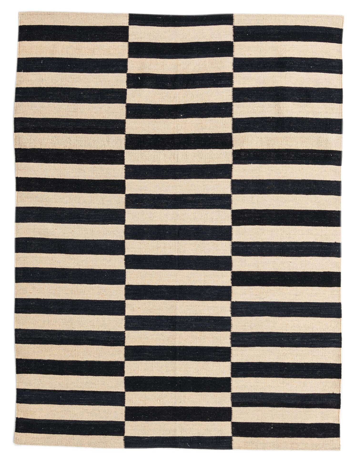 A 4x6 rectangular flatweave rug featuring a bold black and cream striped pattern, ideal for a modern living room.