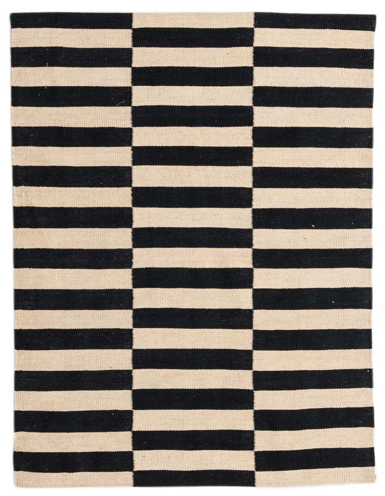 A 4x6 rectangular black and cream flatweave wool rug with a bold striped tribal pattern, suitable for a living room.