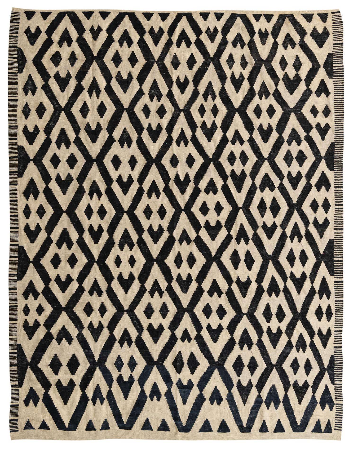 A 7x10 rectangular flatweave wool rug with a black and cream tribal diamond pattern, ideal for a living room.