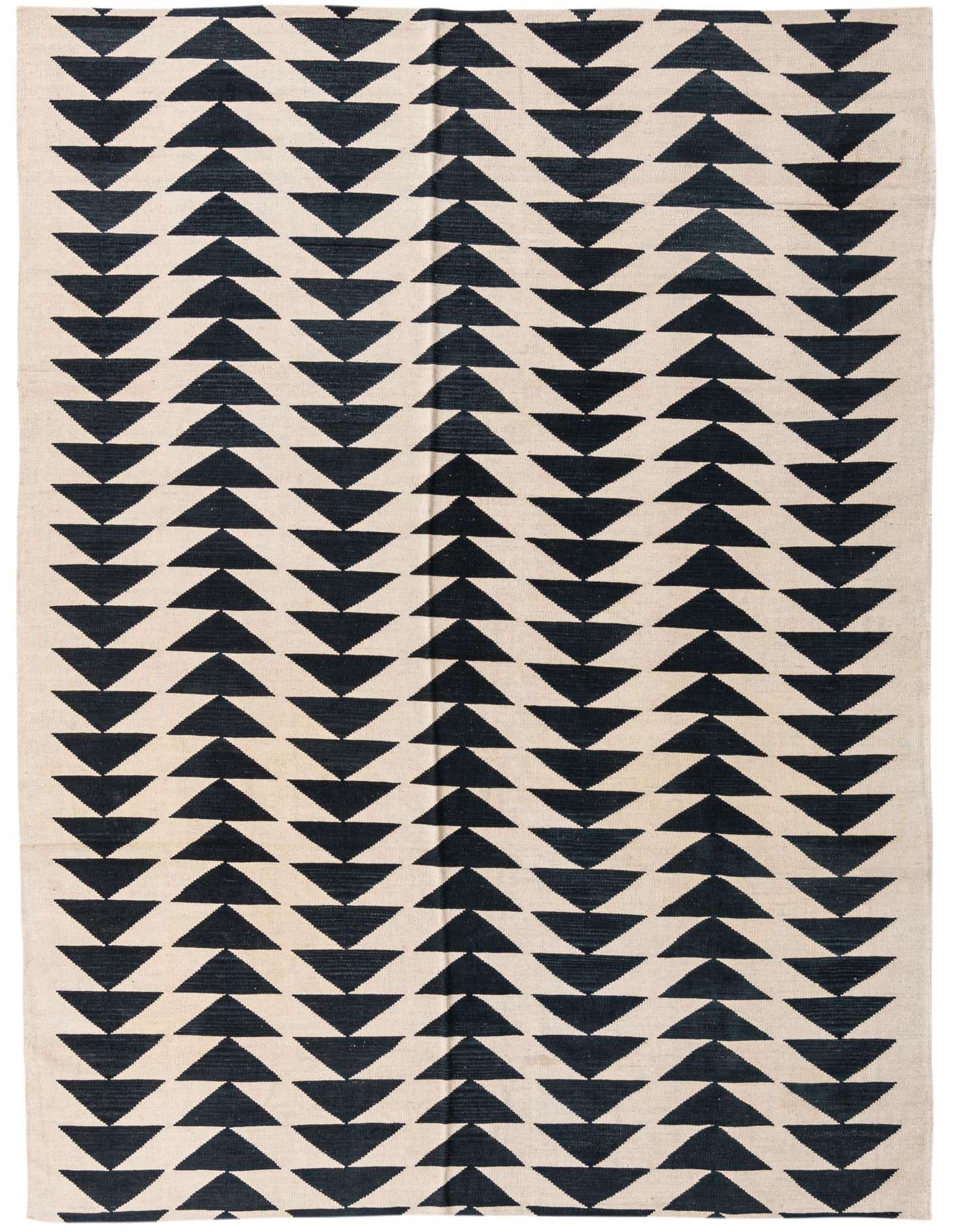 A 7x10 rectangular flatweave rug featuring a repeating pattern of black triangles on an ivory background.