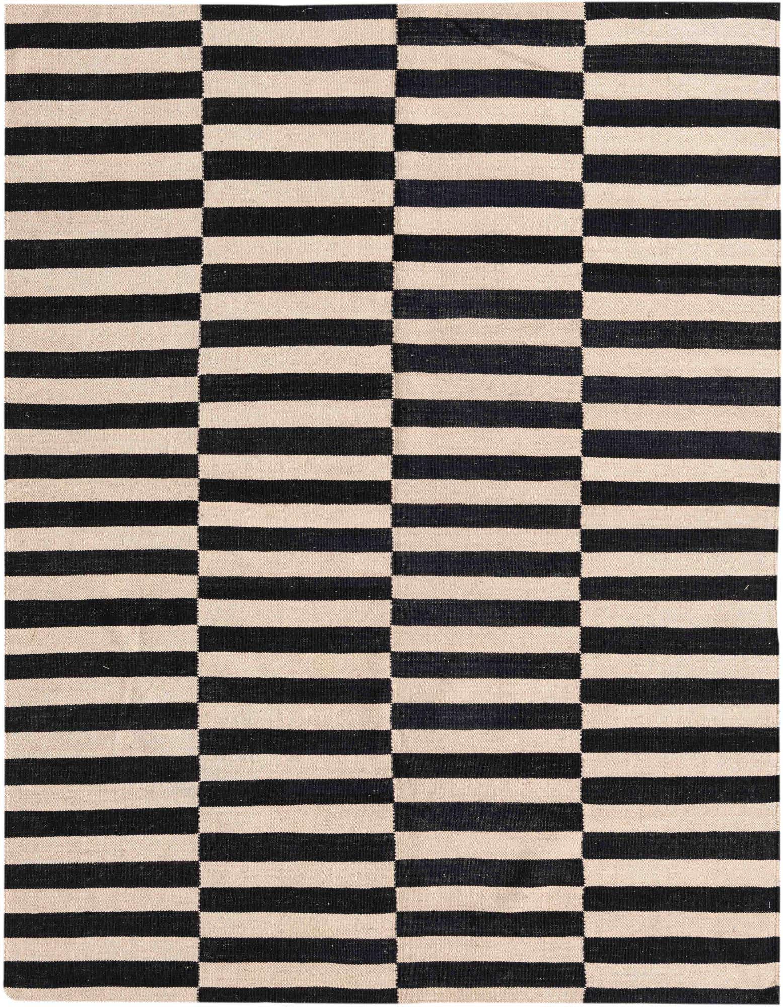 A 5x8 rectangular black and ivory striped flatweave rug with a modern tribal pattern, suitable for a living room.
