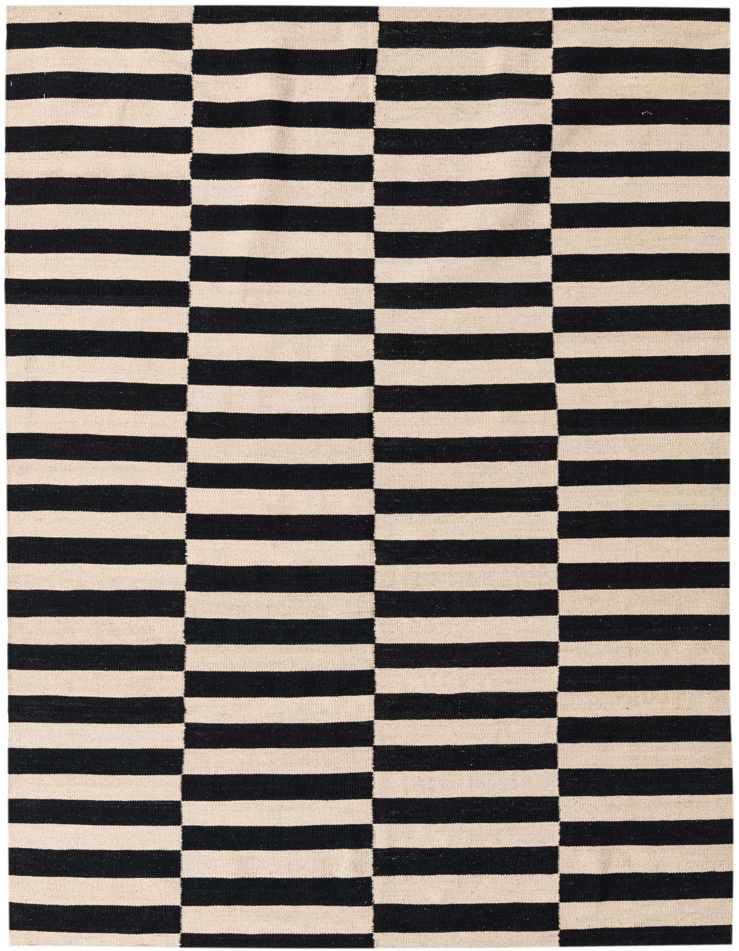 A 5x8 rectangular black and ivory flatweave wool rug with a modern tribal stripe pattern.