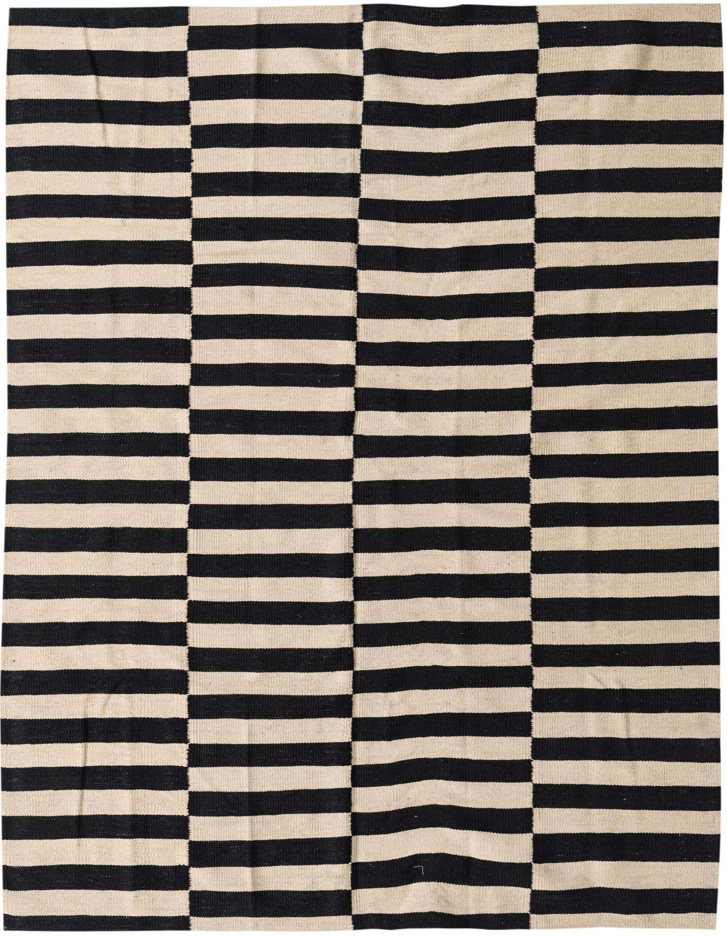 A 4x6 rectangular flatweave rug with a bold black and ivory striped pattern, perfect for a modern living room.
