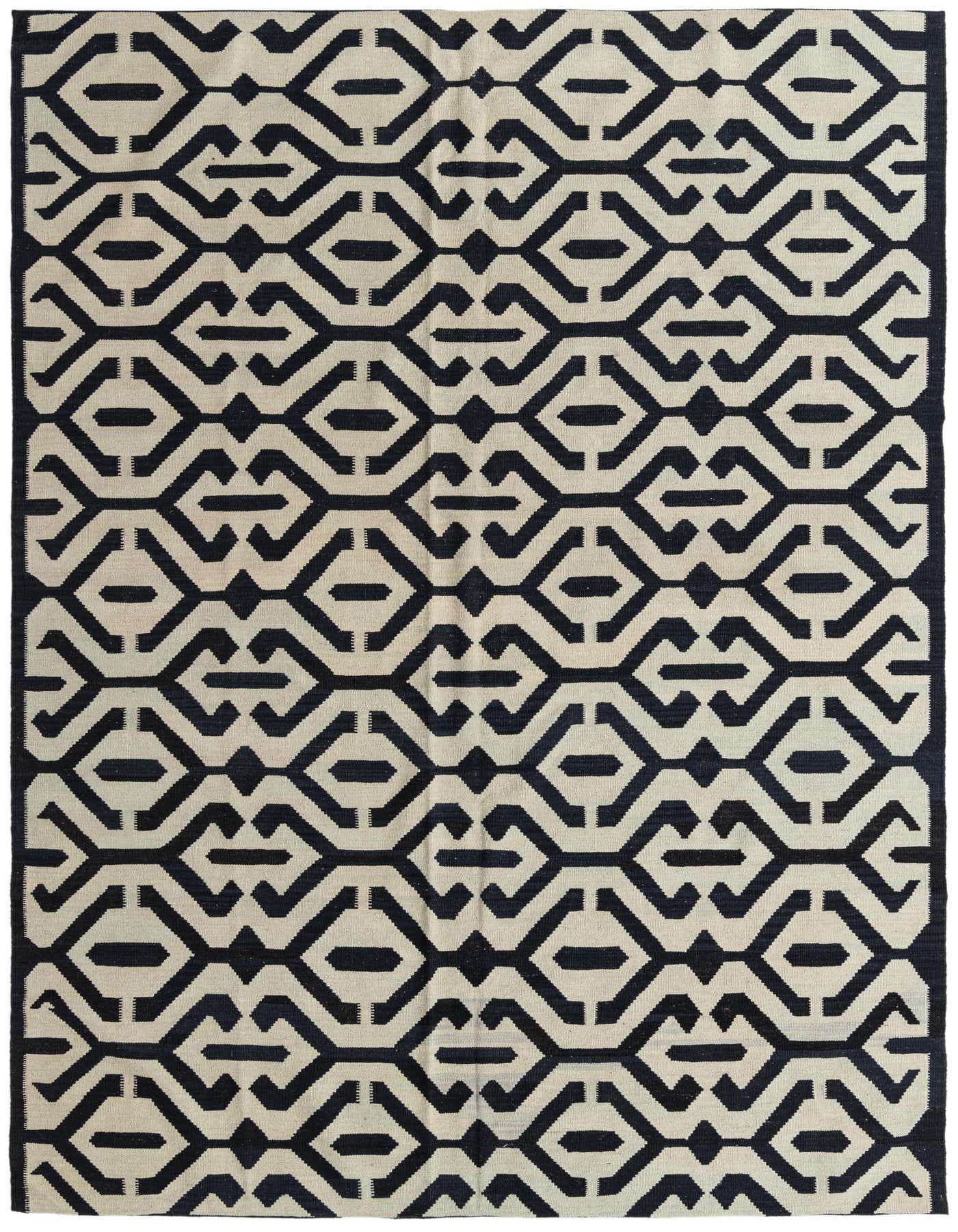 A 7x10 rectangular flatweave Kilim Modern rug featuring a bold black and ivory tribal geometric pattern.