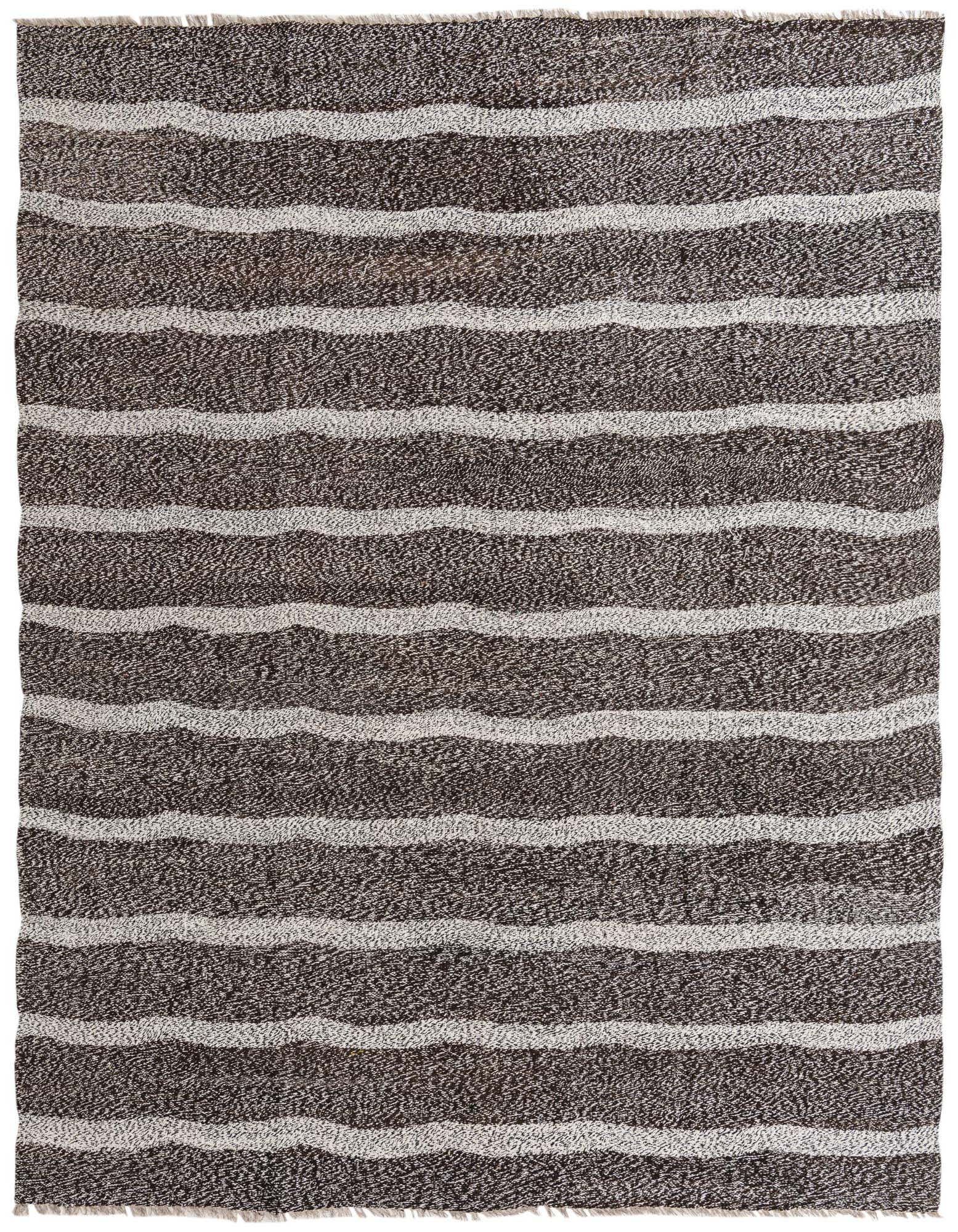 A rectangular 8x10 black and white tribal flatweave rug with wavy horizontal stripes, suitable for a living room.