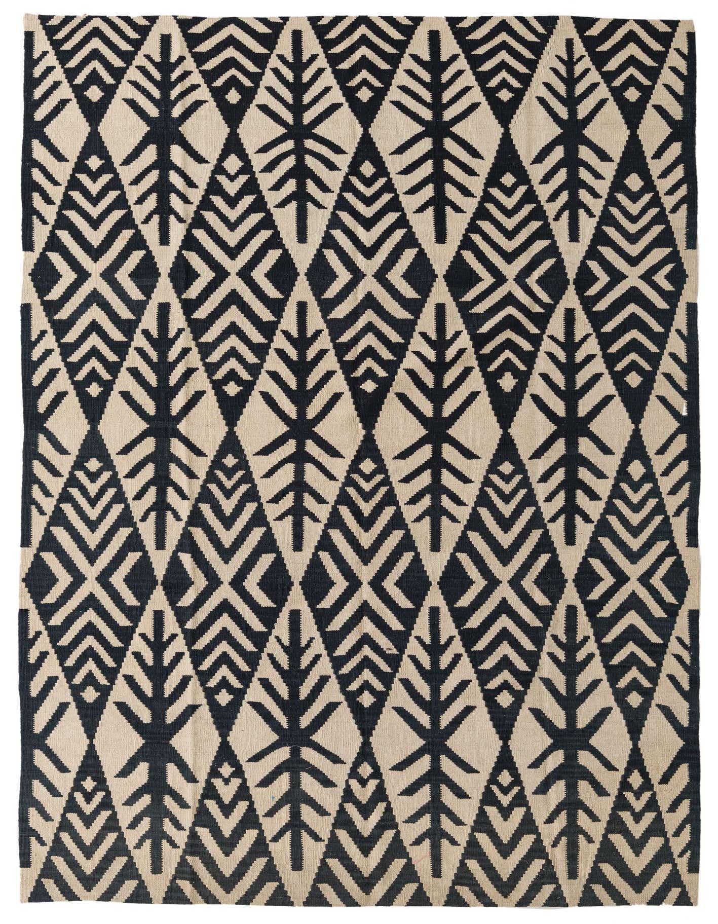 A 6x9 rectangular flatweave rug featuring a bold tribal pattern of black geometric trees and diamonds on an ivory background.