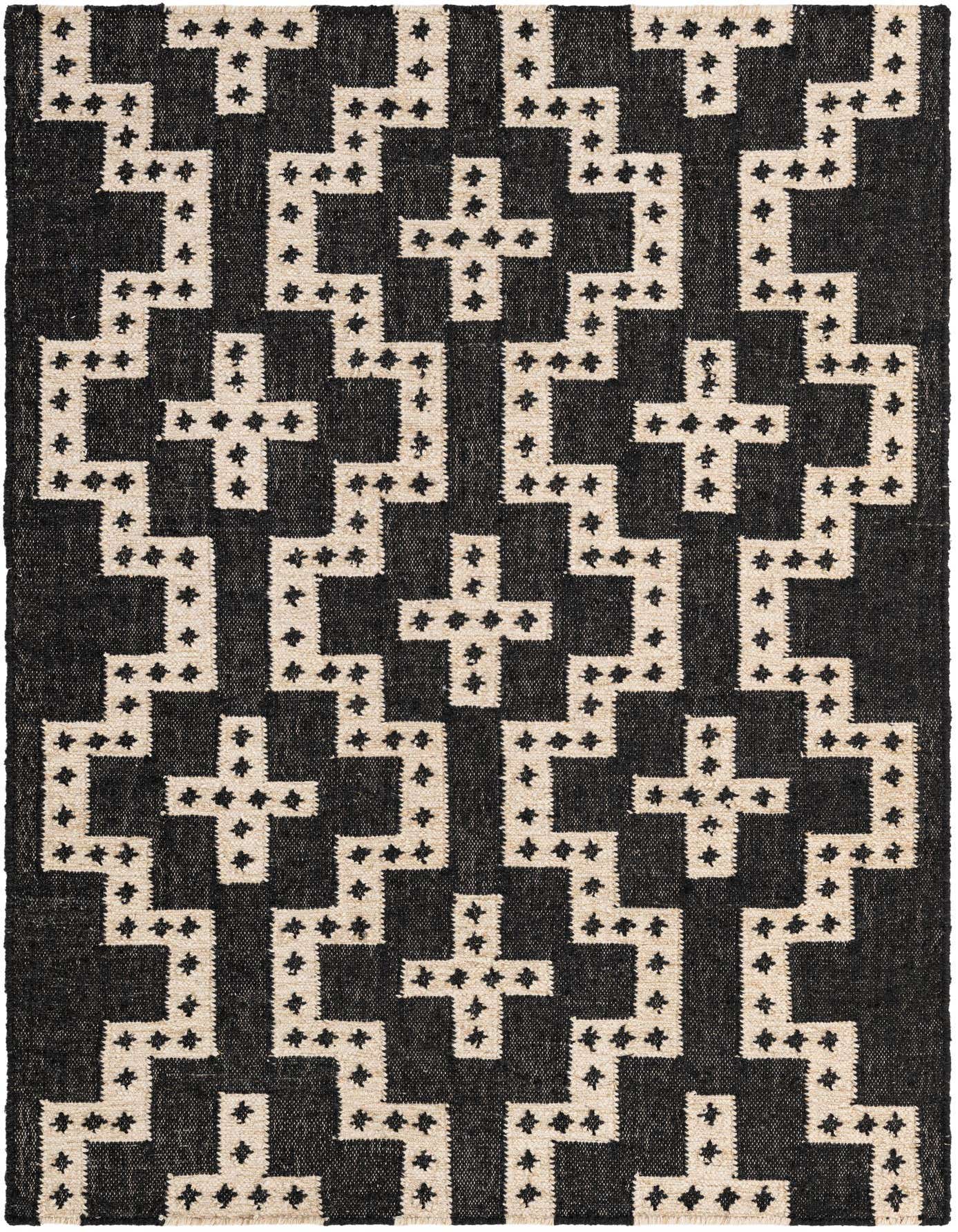 A 4x6 rectangular black and ivory wool flatweave rug with a repeating tribal geometric pattern.