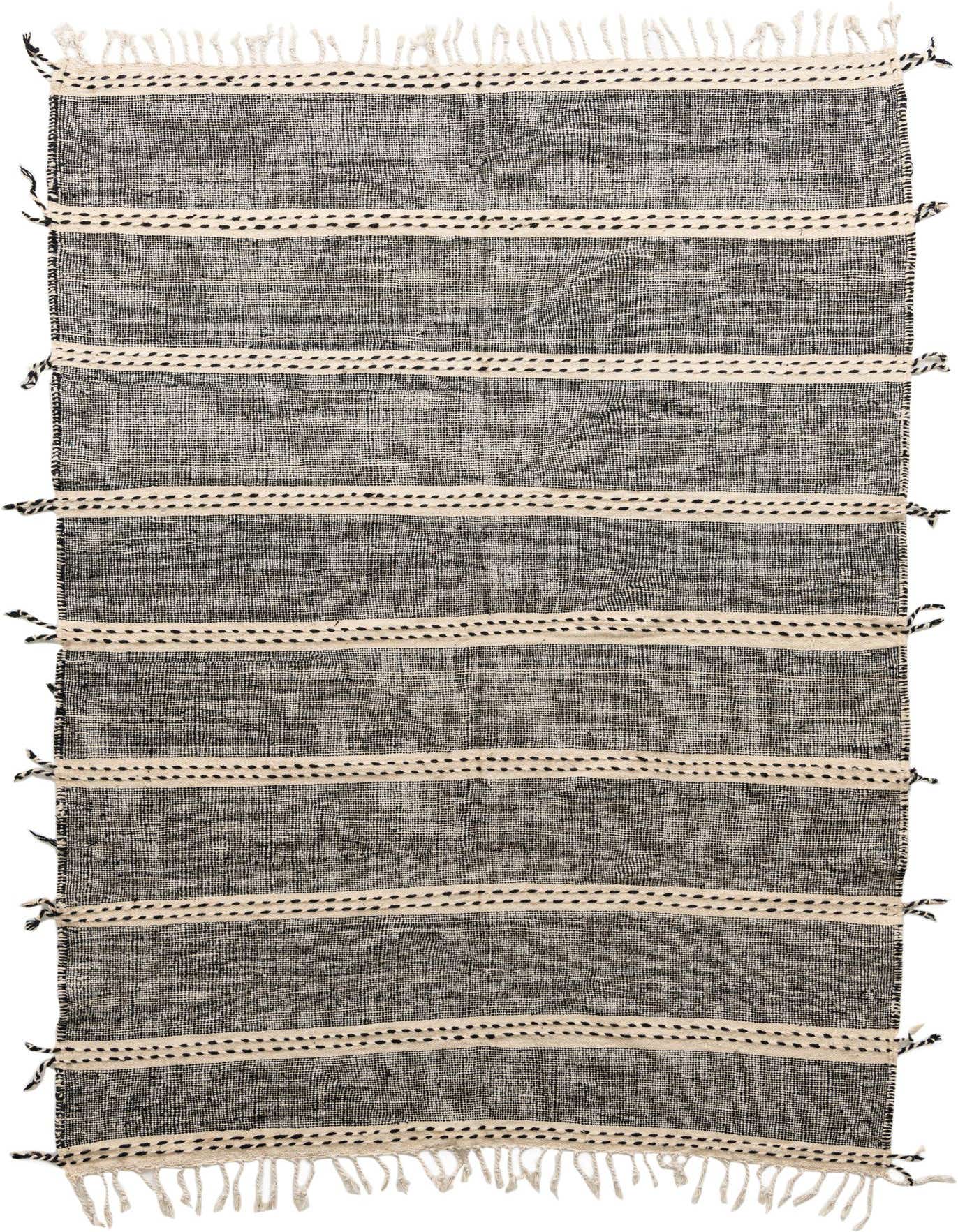A 6x9 rectangular black and ivory tribal wool rug with horizontal stripes and fringe ends, perfect for a modern living room.