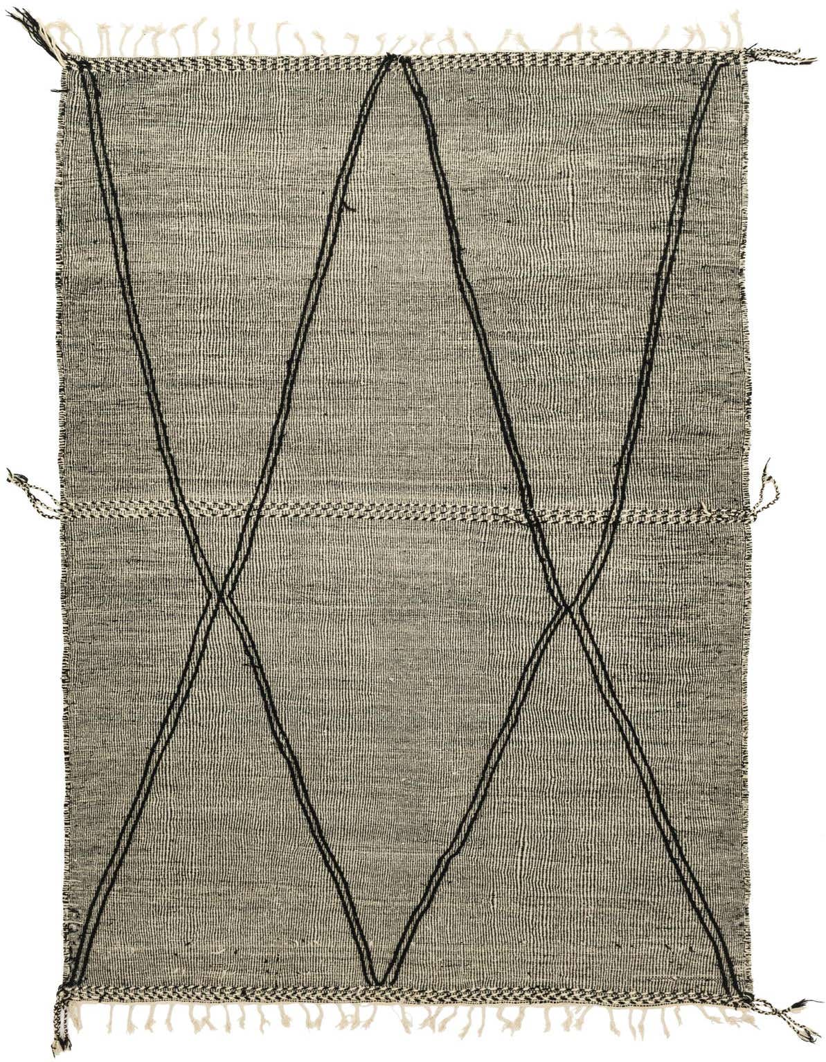 A 9x12 rectangular black and white tribal wool shag rug with a modern abstract pattern and fringe.