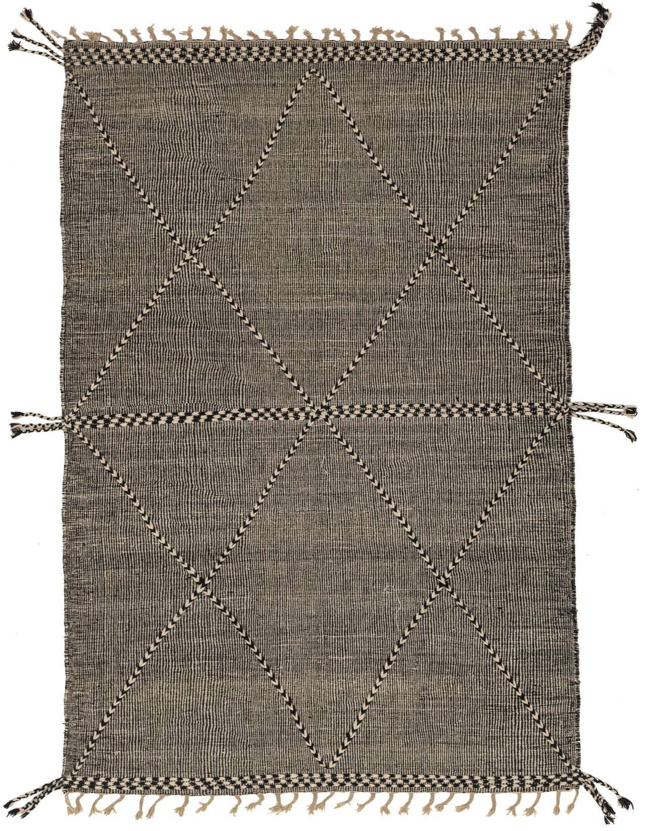 A 10x13 rectangular black and white Moroccan wool shag rug with a modern tribal diamond pattern and braided tassels.