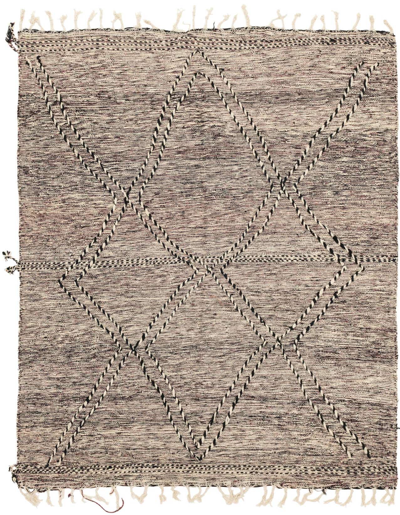 A 7x10 rectangular Moroccan shag rug with a tribal diamond pattern in black and ivory, featuring fringed edges.