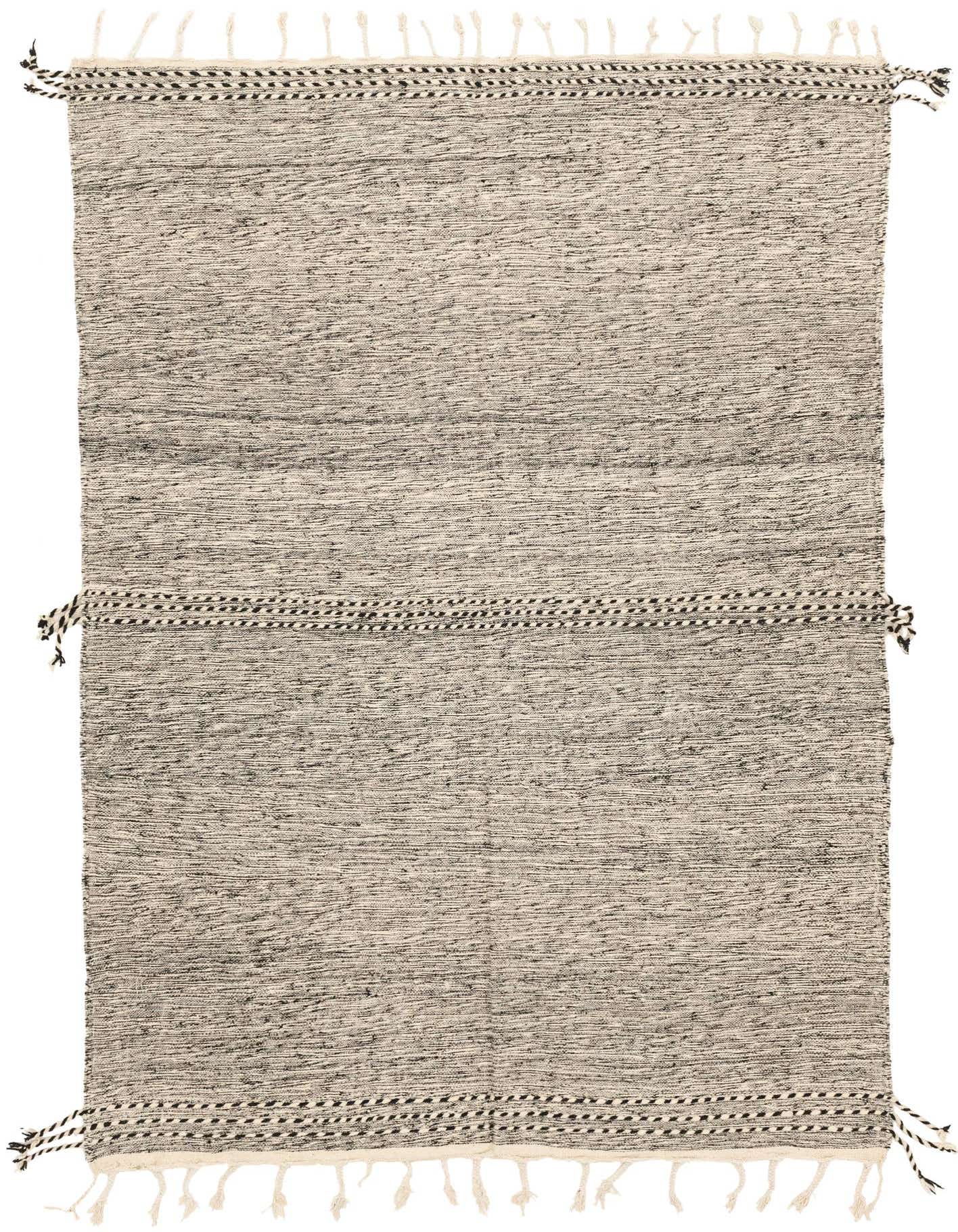 A 6x9 rectangular Moroccan tribal shag rug in black and white, featuring a textured weave and decorative tassels.