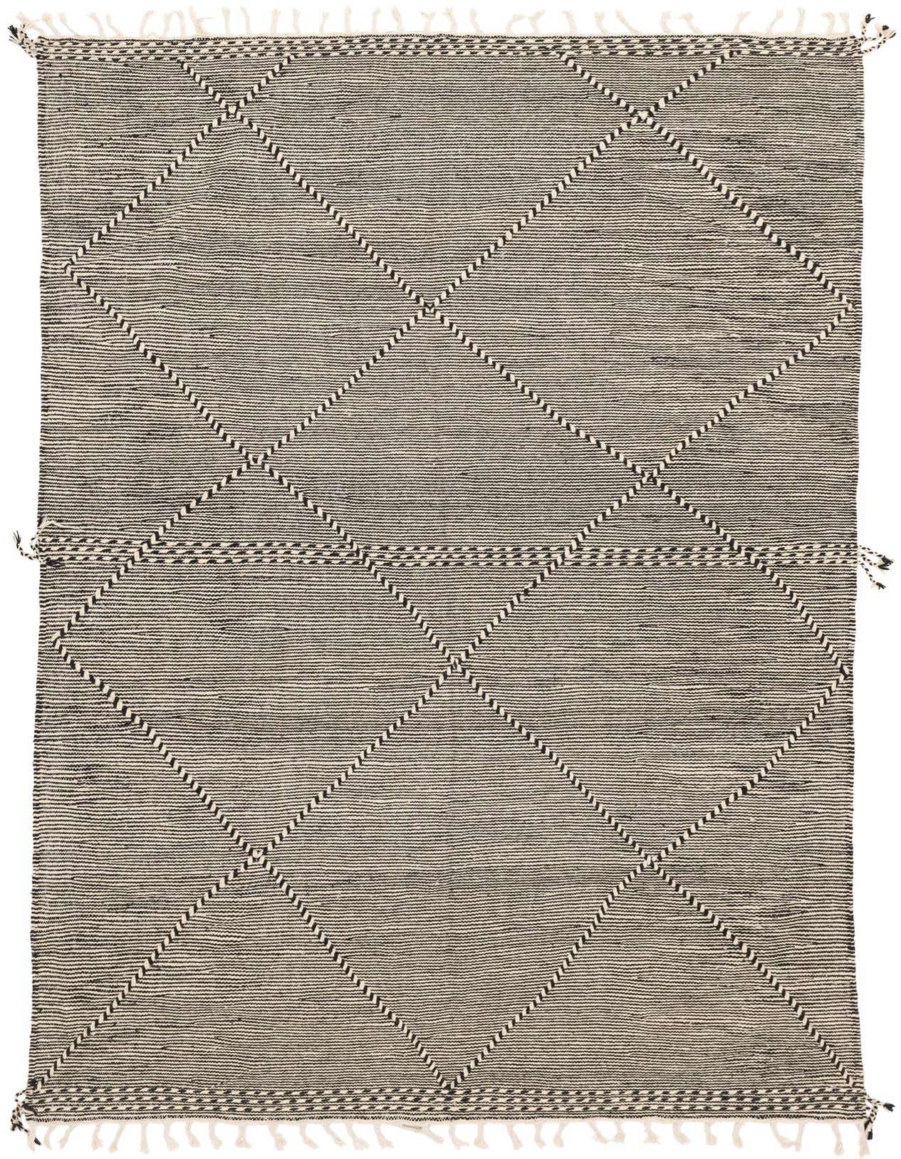 A 6x9 rectangular Moroccan shag rug in black and ivory, featuring a tribal diamond pattern and fringe.
