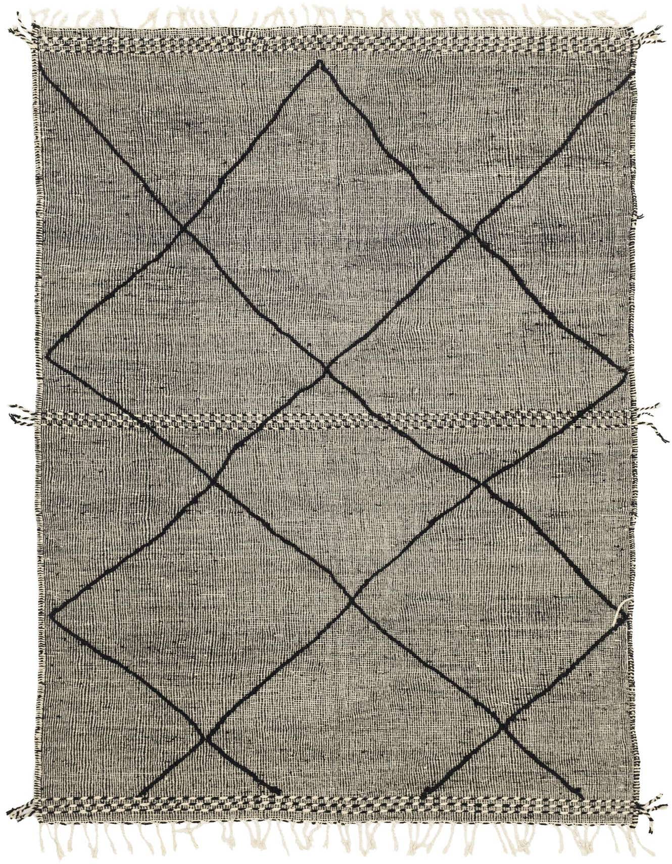 A 6x9 rectangular Moroccan shag rug in black and ivory with a tribal diamond pattern and fringe.